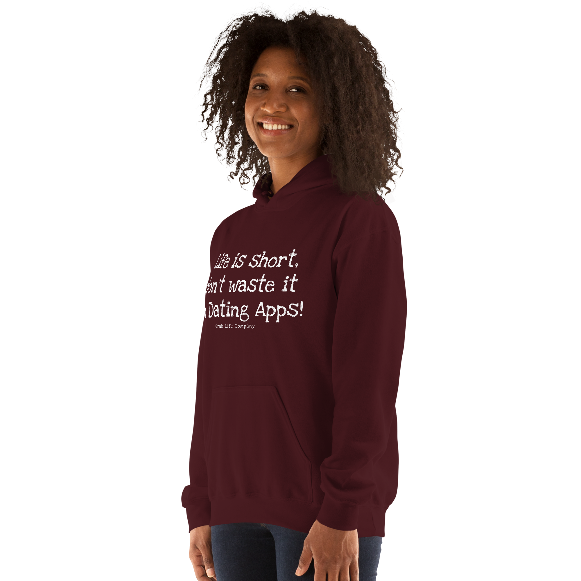Grab Life Company unisex sweatshirt with Life is Short Don't Waste it on Dating Apps printed in white on maroon hoodie. Image shows woman wearing the sweatshirt.