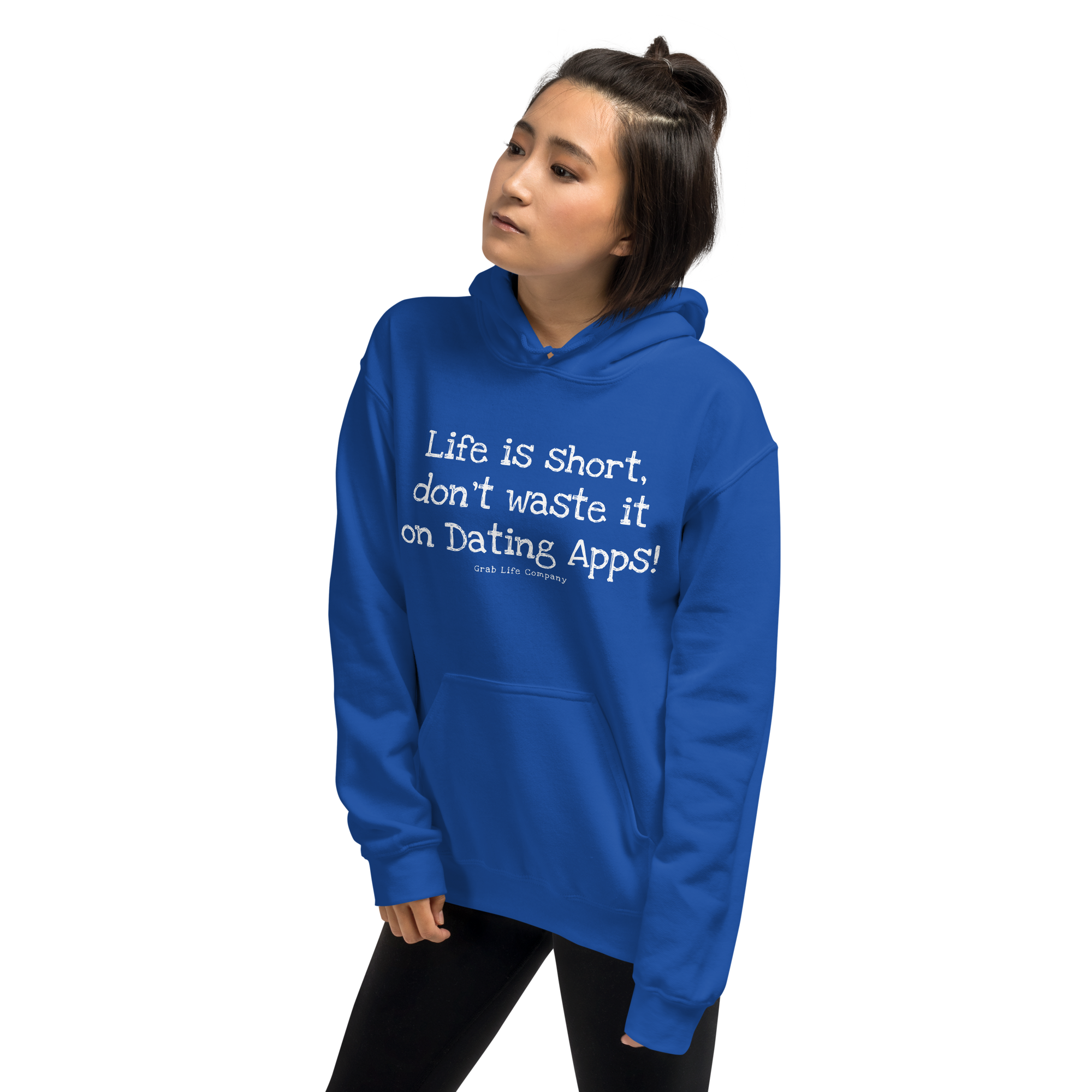 Grab Life Company unisex sweatshirt with Life is Short Don't Waste it on Dating Apps printed in white on royal blue hoodie. Image shows woman wearing the sweatshirt.