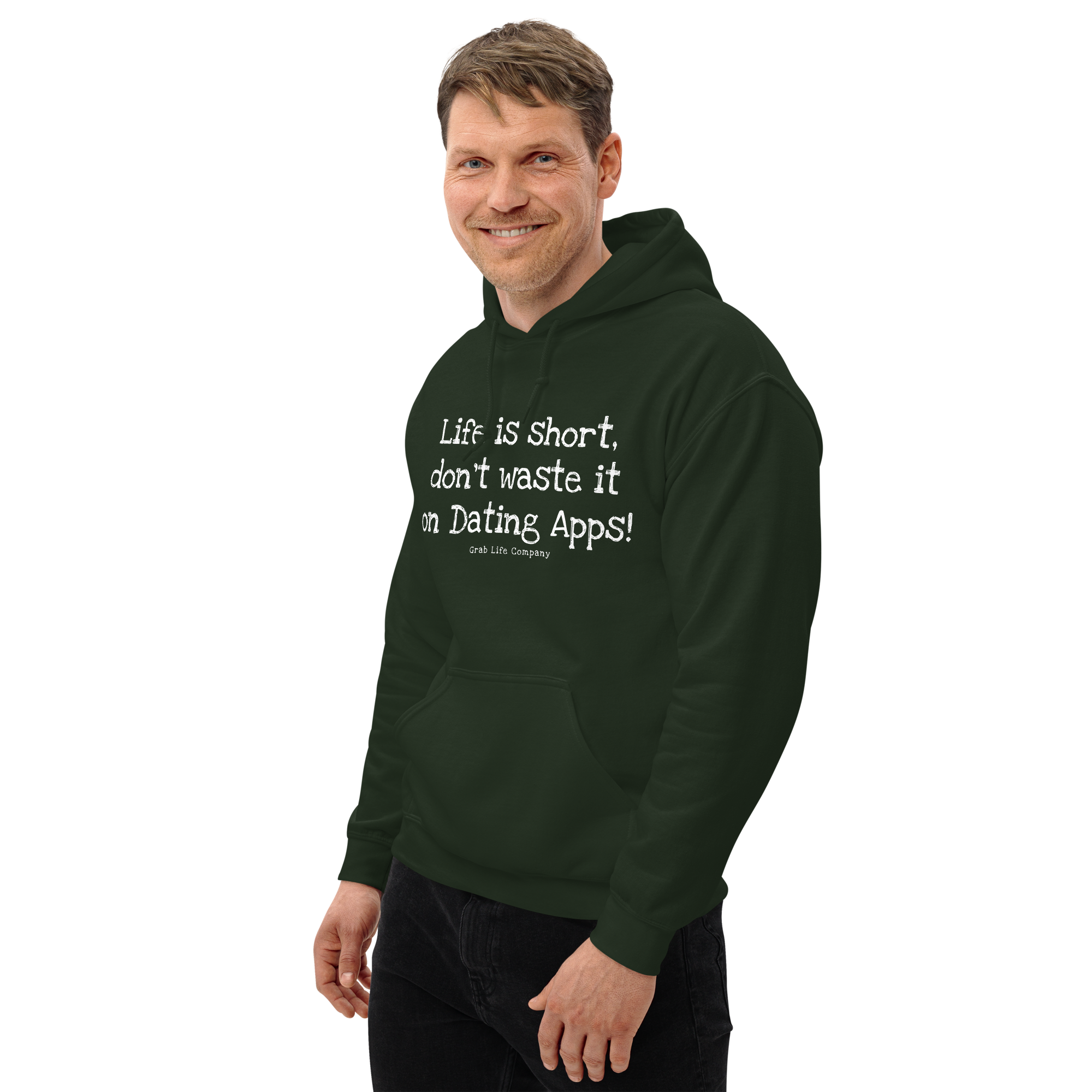 Grab Life Company unisex sweatshirt with Life is Short Don't Waste it on Dating Apps printed in white on forest green hoodie. Image shows man wearing the sweatshirt.