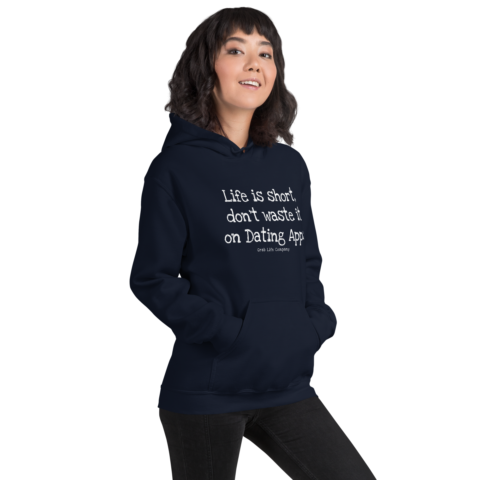 Grab Life Company unisex sweatshirt with Life is Short Don't Waste it on Dating Apps printed in white on navy hoodie. Image shows woman wearing the sweatshirt.