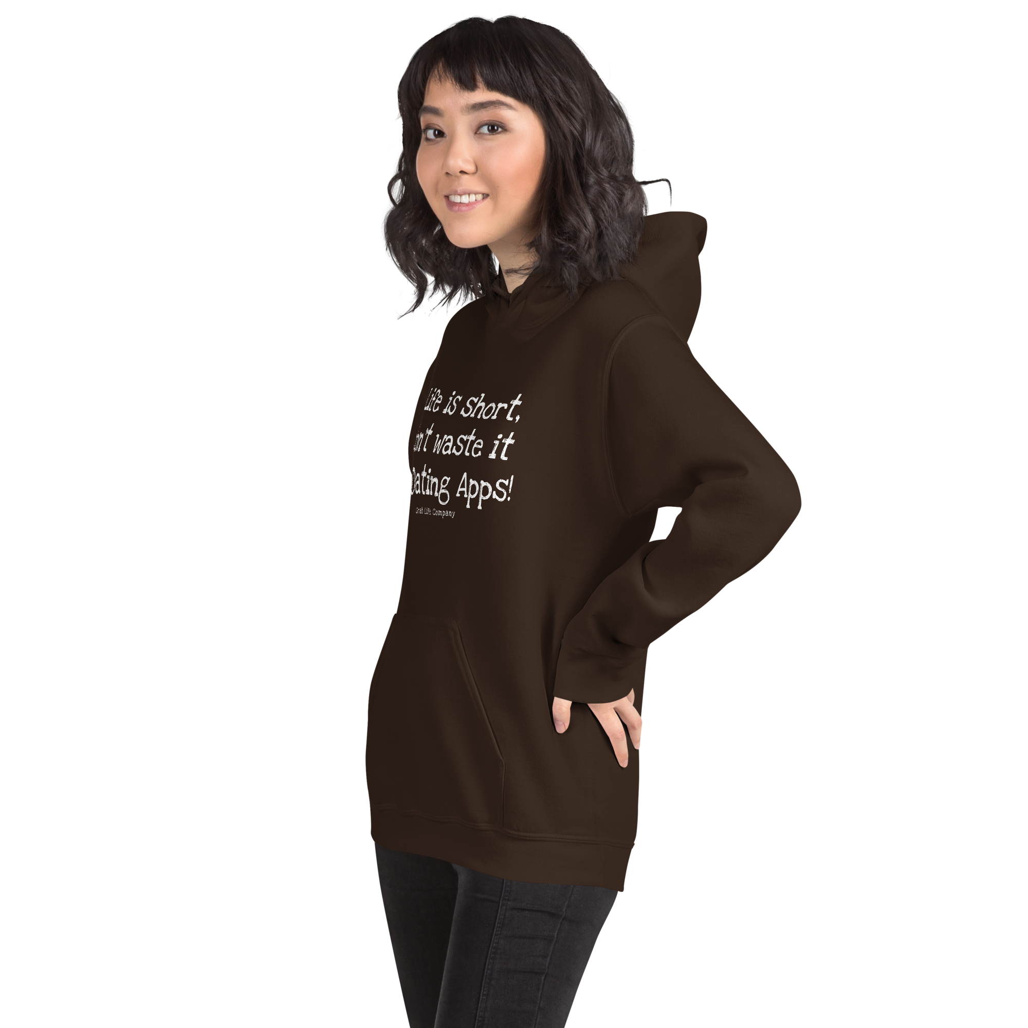 Grab Life Company unisex sweatshirt with Life is Short Don't Waste it on Dating Apps printed in white on dark chocolate hoodie. Image shows woman wearing the sweatshirt.