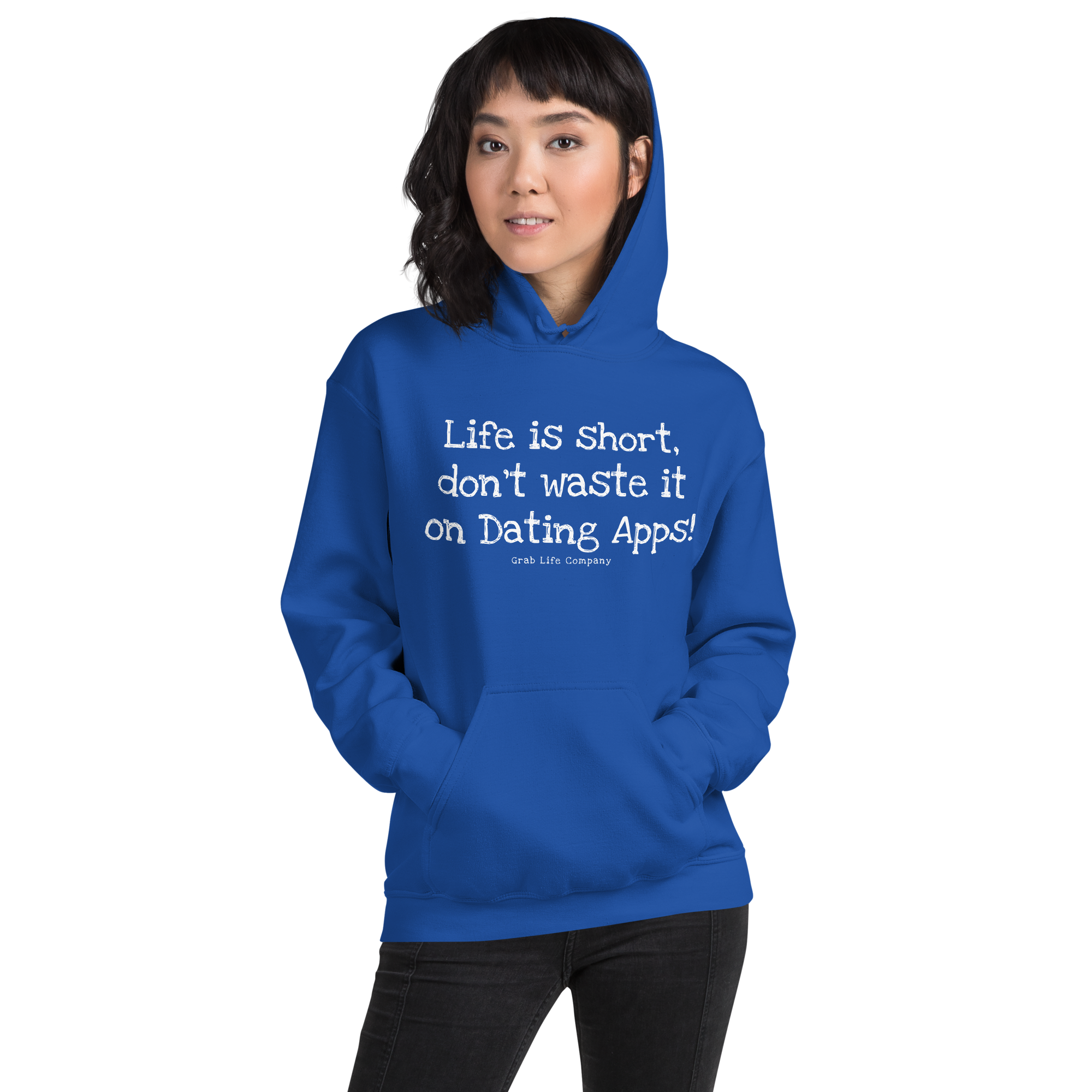 Grab Life Company unisex sweatshirt with Life is Short Don't Waste it on Dating Apps printed in white on royal blue hoodie. Image shows woman wearing the sweatshirt.
