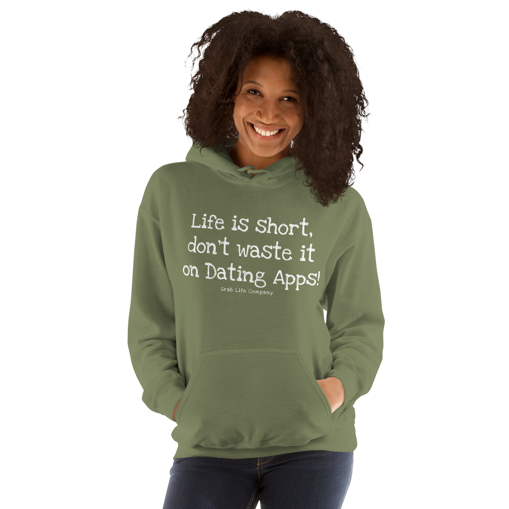 Grab Life Company unisex sweatshirt with Life is Short Don't Waste it on Dating Apps printed in white on military green hoodie. Image shows woman wearing the sweatshirt.