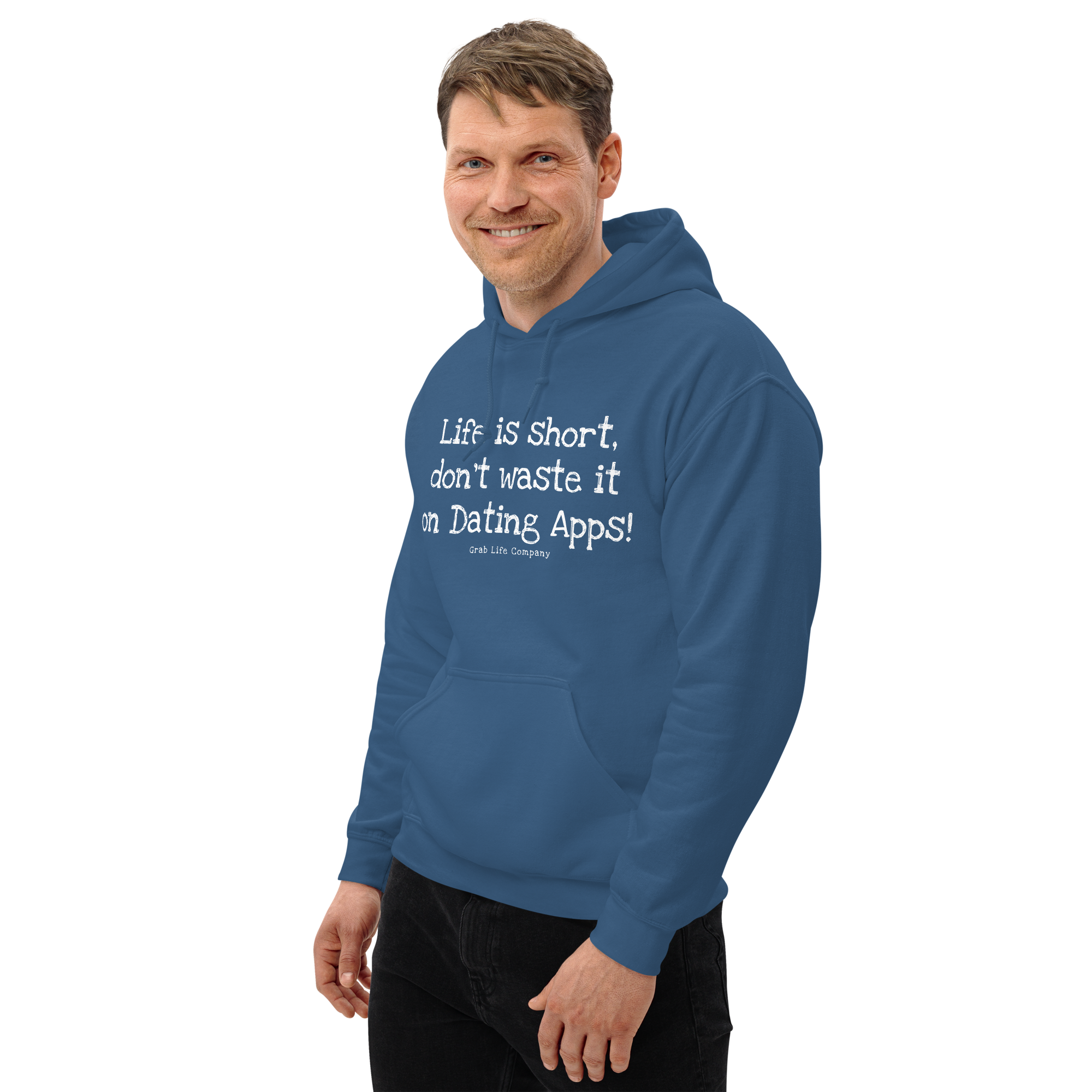 Grab Life Company unisex sweatshirt with Life is Short Don't Waste it on Dating Apps printed in white on indigo blue hoodie. Image shows man wearing the sweatshirt.