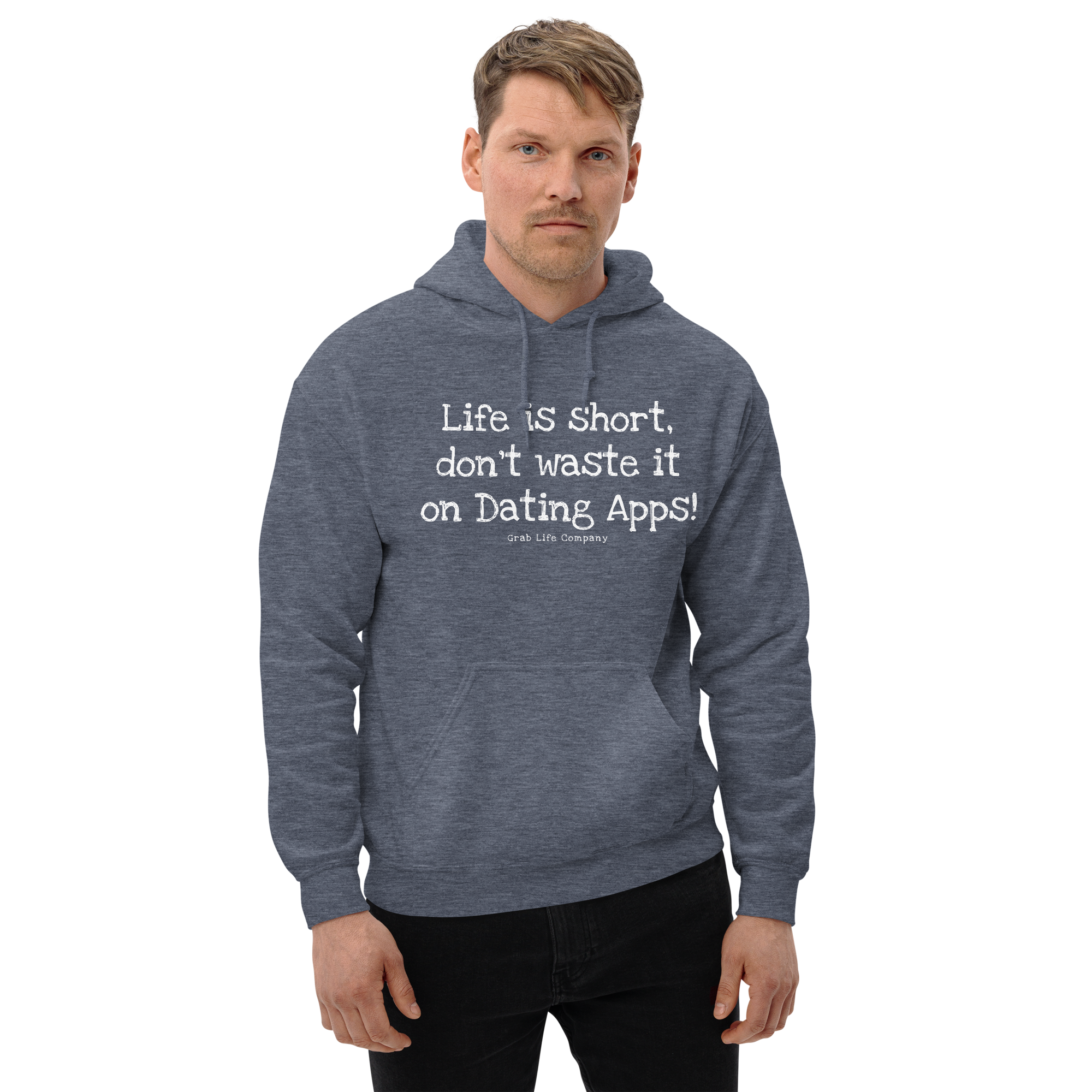 Grab Life Company unisex sweatshirt with Life is Short Don't Waste it on Dating Apps printed in white on heather sport dark navy hoodie. Image shows man wearing the sweatshirt.