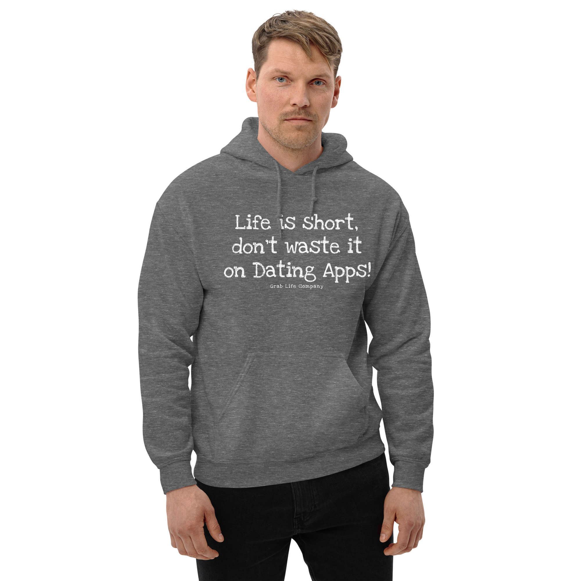 Grab Life Company unisex sweatshirt with Life is Short Don't Waste it on Dating Apps printed in white on graphite heather hoodie. Image shows man wearing the sweatshirt.