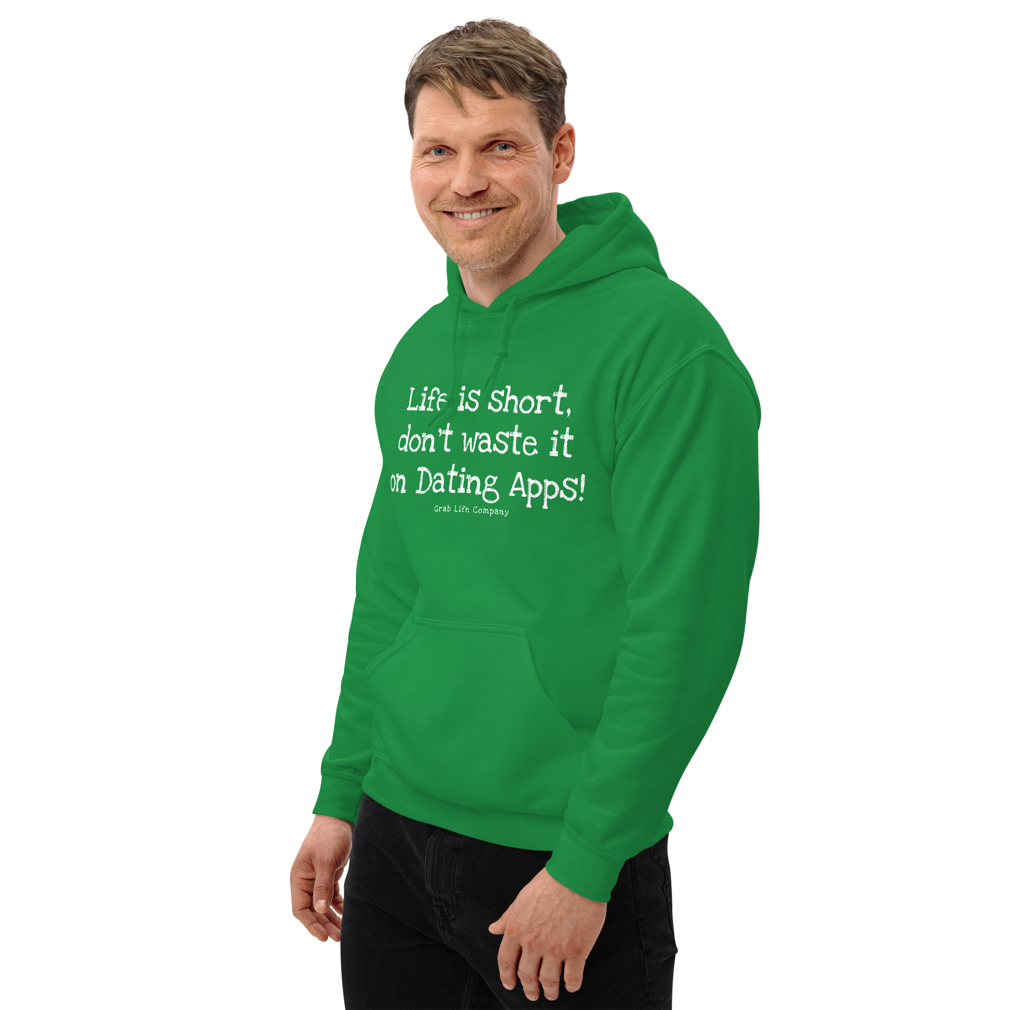 Grab Life Company unisex sweatshirt with Life is Short Don't Waste it on Dating Apps printed in white on Irish green hoodie. Image shows man wearing the sweatshirt.