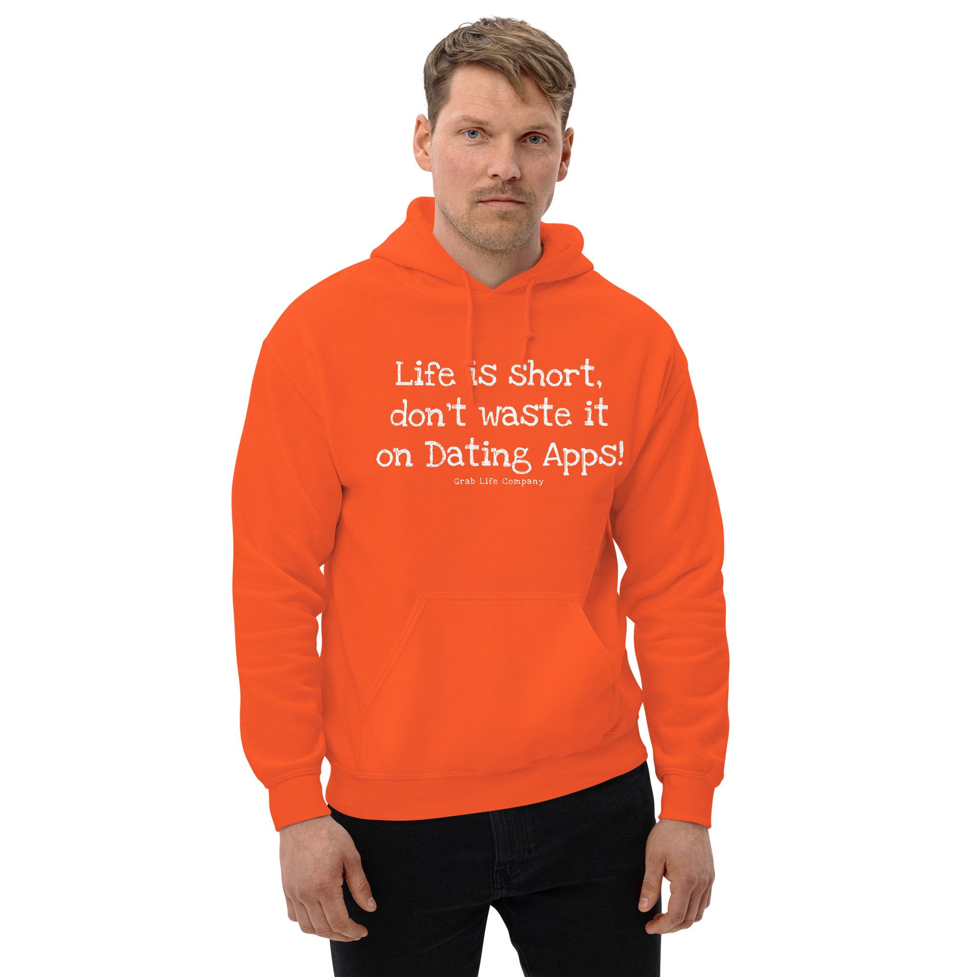 Grab Life Company unisex sweatshirt with Life is Short Don't Waste it on Dating Apps printed in white on orange hoodie. Image shows man wearing the sweatshirt.