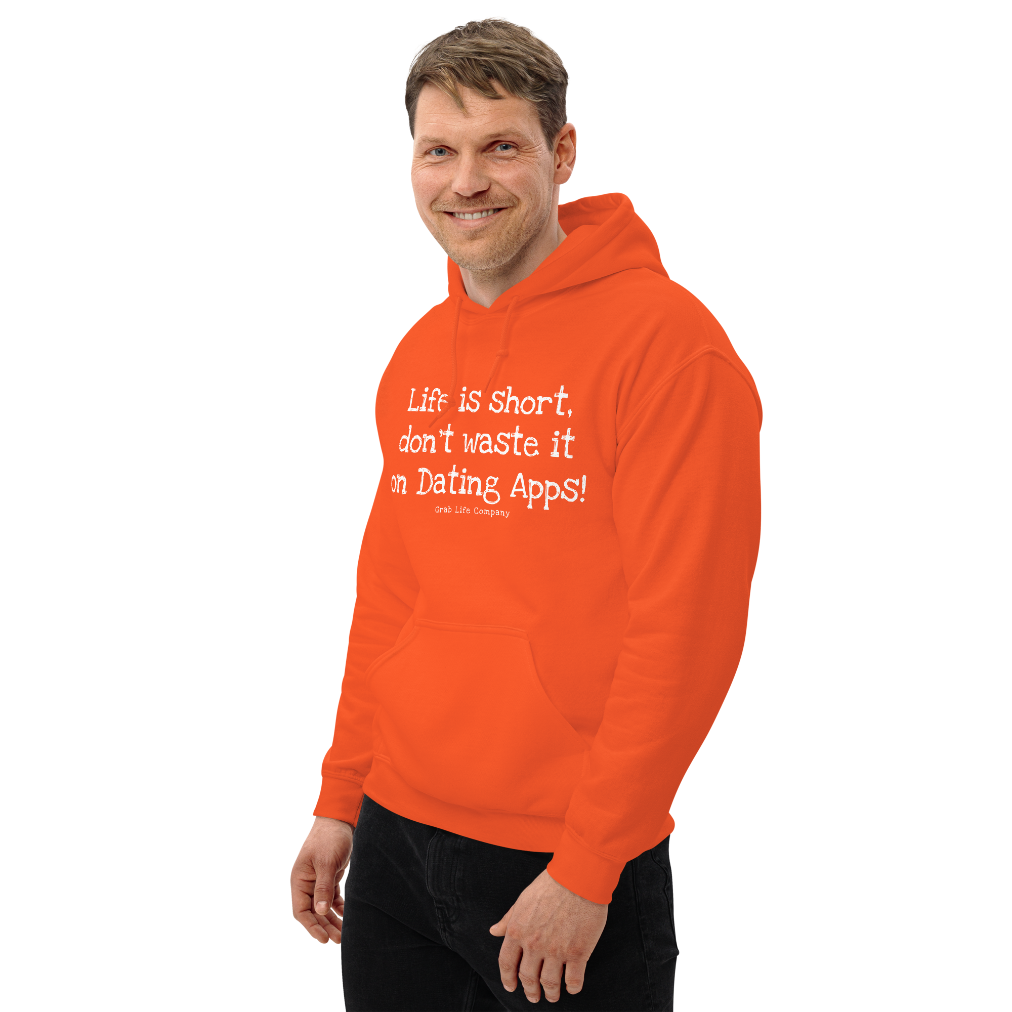 Grab Life Company unisex sweatshirt with Life is Short Don't Waste it on Dating Apps printed in white on orange hoodie. Image shows man wearing the sweatshirt.