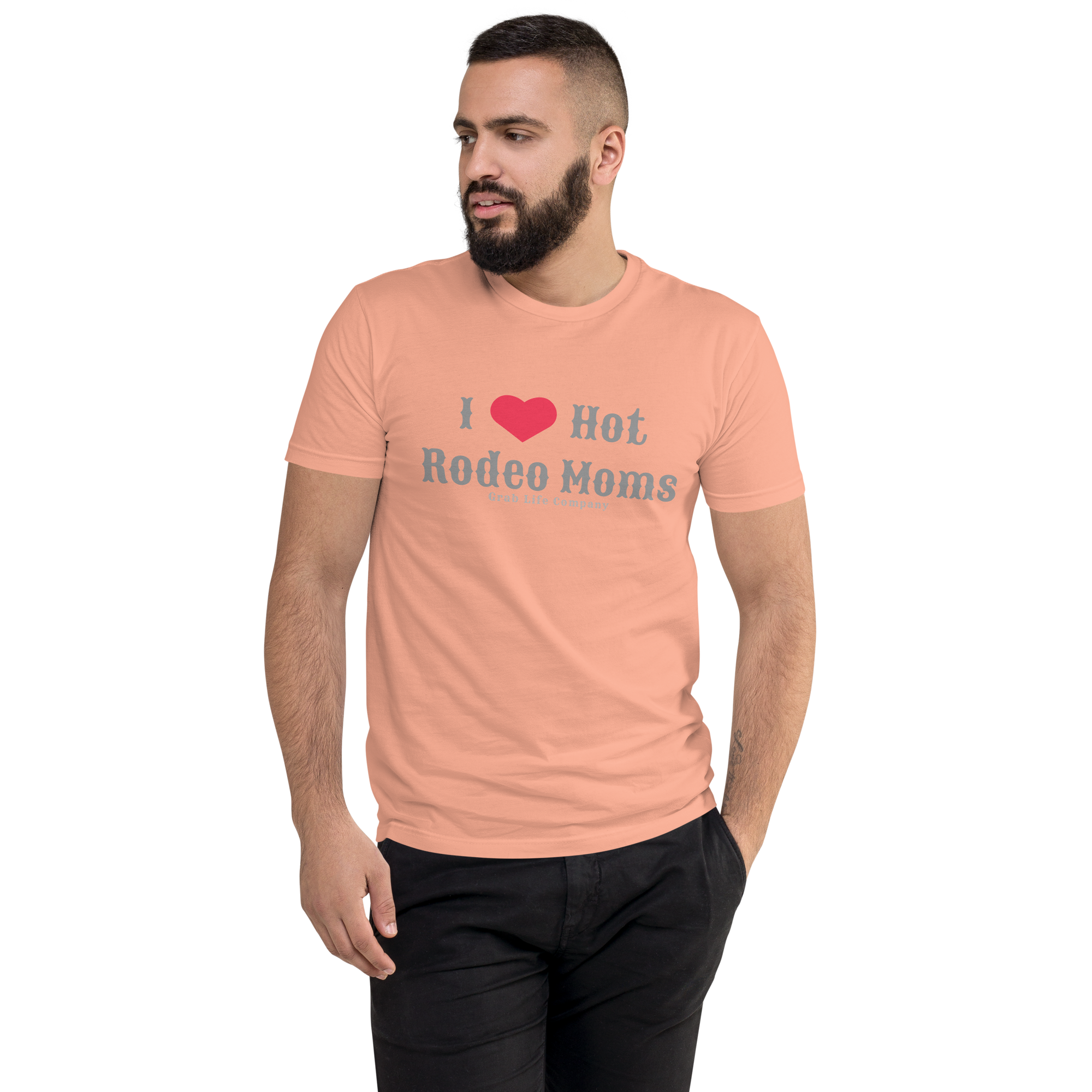 Grab Life Company men's fitted t-shirt printed with I Heart Hot Rodeo Moms in grey on a desert pink tee. Image shows a man wearing the shirt.