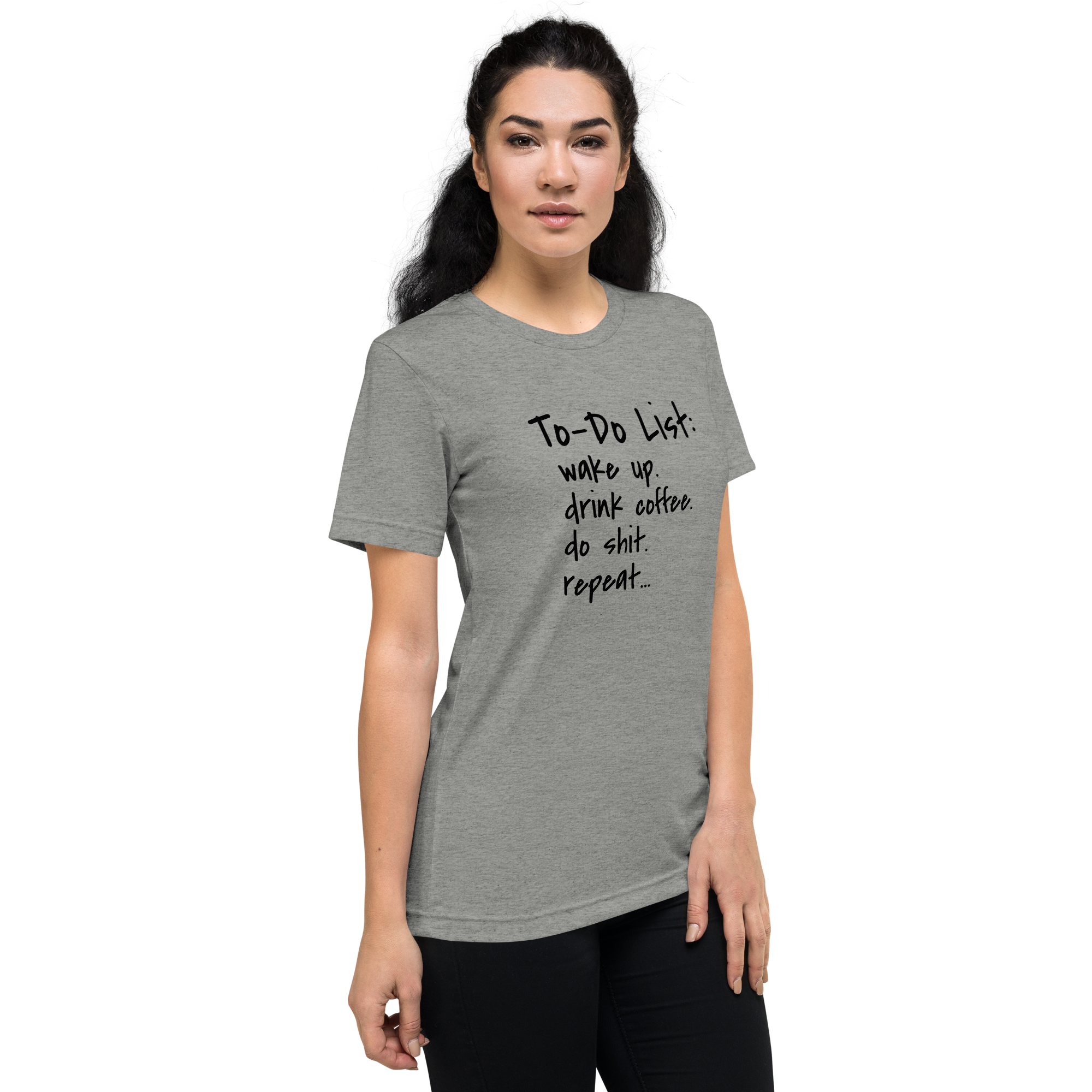 Grab Life Company unisex t-shirt with To-Do List: wake up. drink coffee. do shit. repeat. written on the front in black on a athletic grey triblend tee. Image shows a woman wearing the shirt.