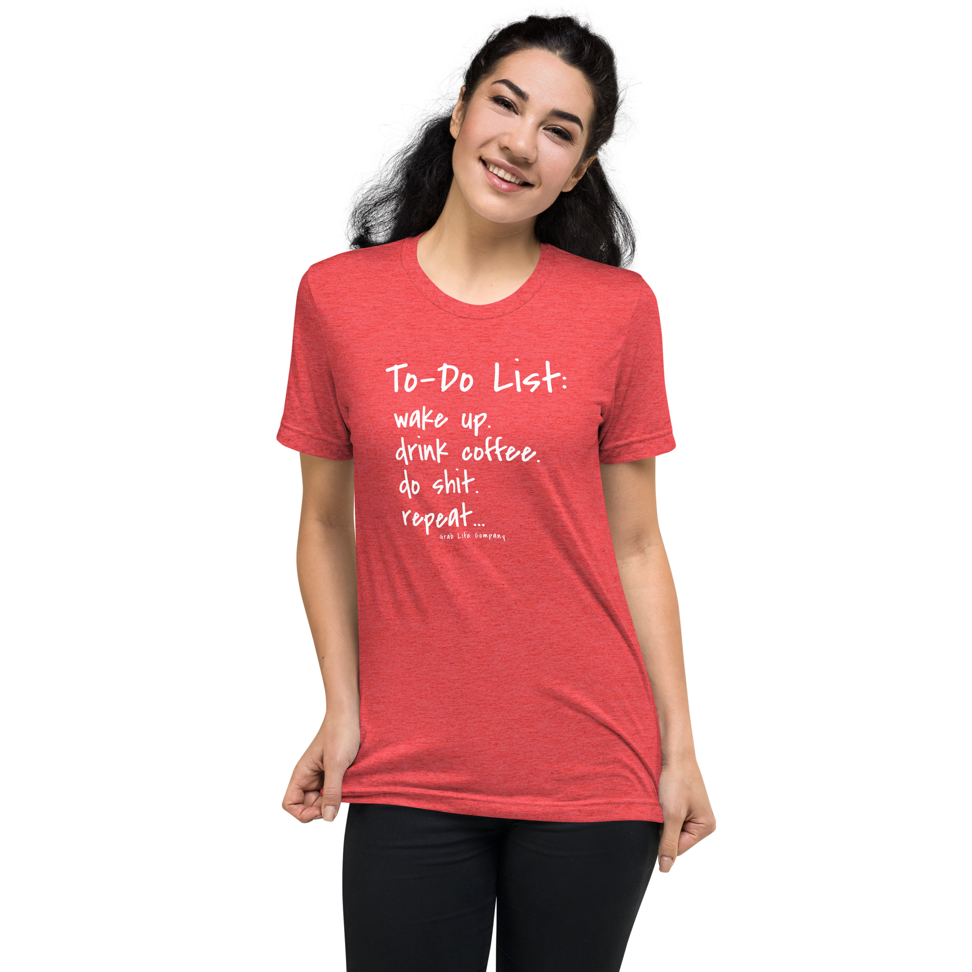 Grab Life Company unisex t-shirt with To-Do List: wake up. drink coffee. do shit. repeat. written on the front in white on a red triblend tee. Image shows a woman wearing the shirt.