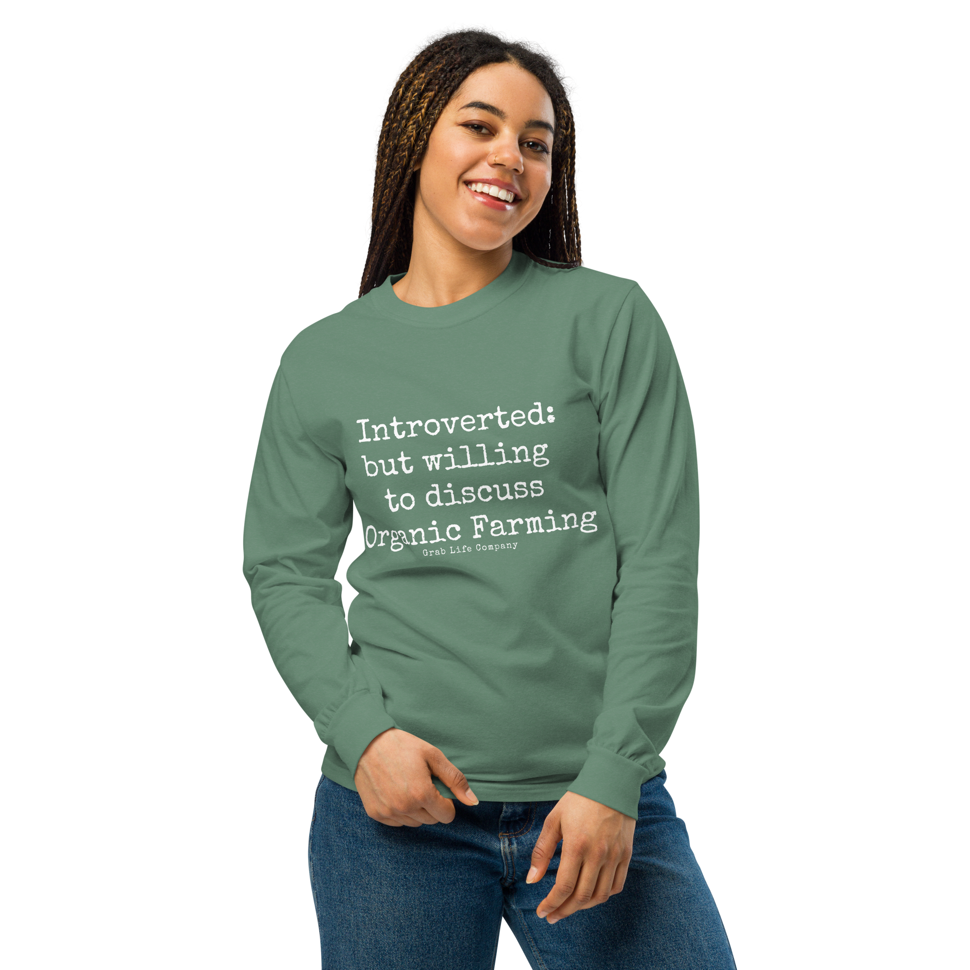 Grab Life Company unisex long-sleeve tee with Introverted: but willing to discuss organic farming written in white on the front of a light green shirt. Image shows woman wearing the shirt.