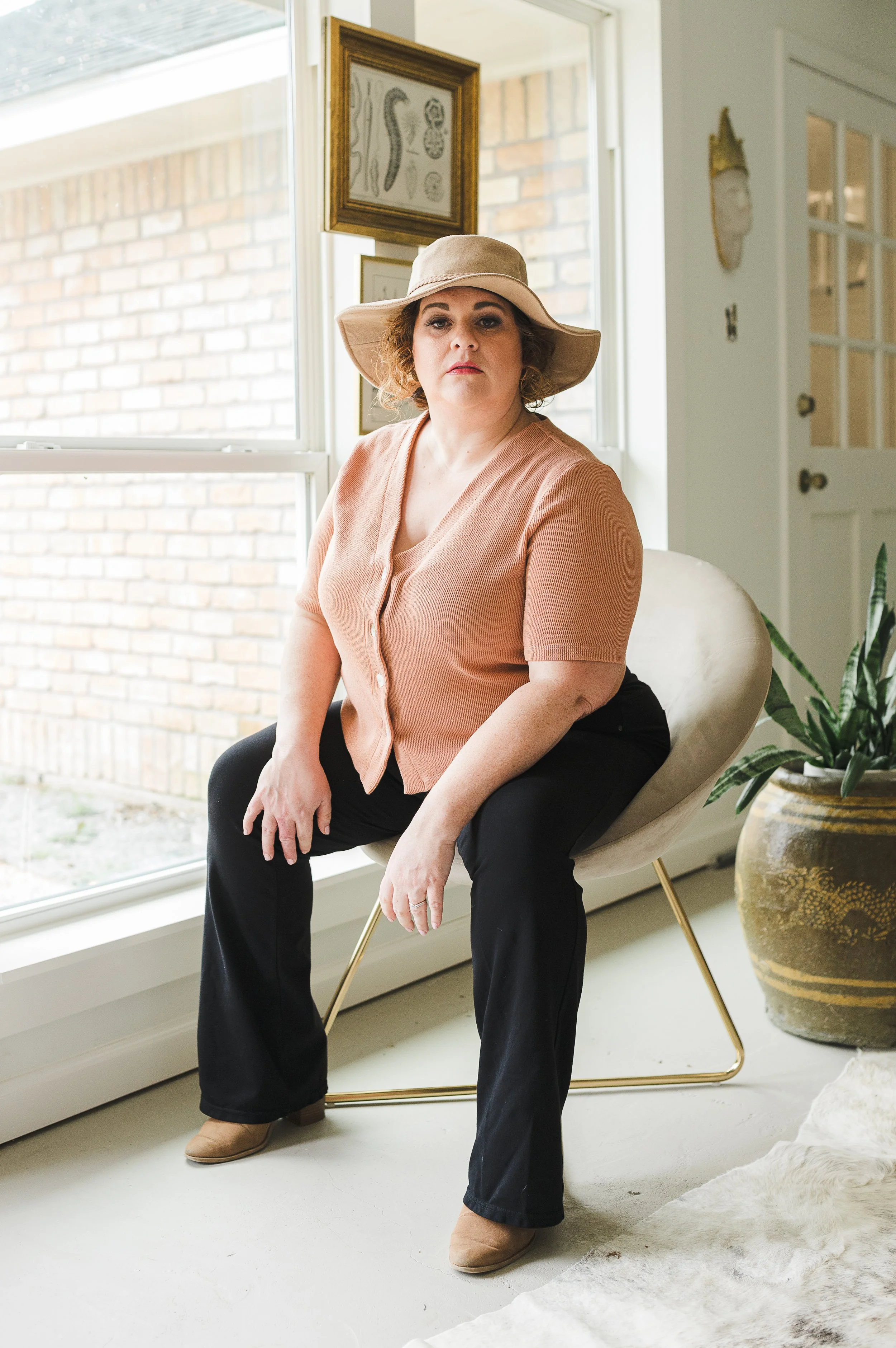 Peach ribbed button-front top with a V-neckline.