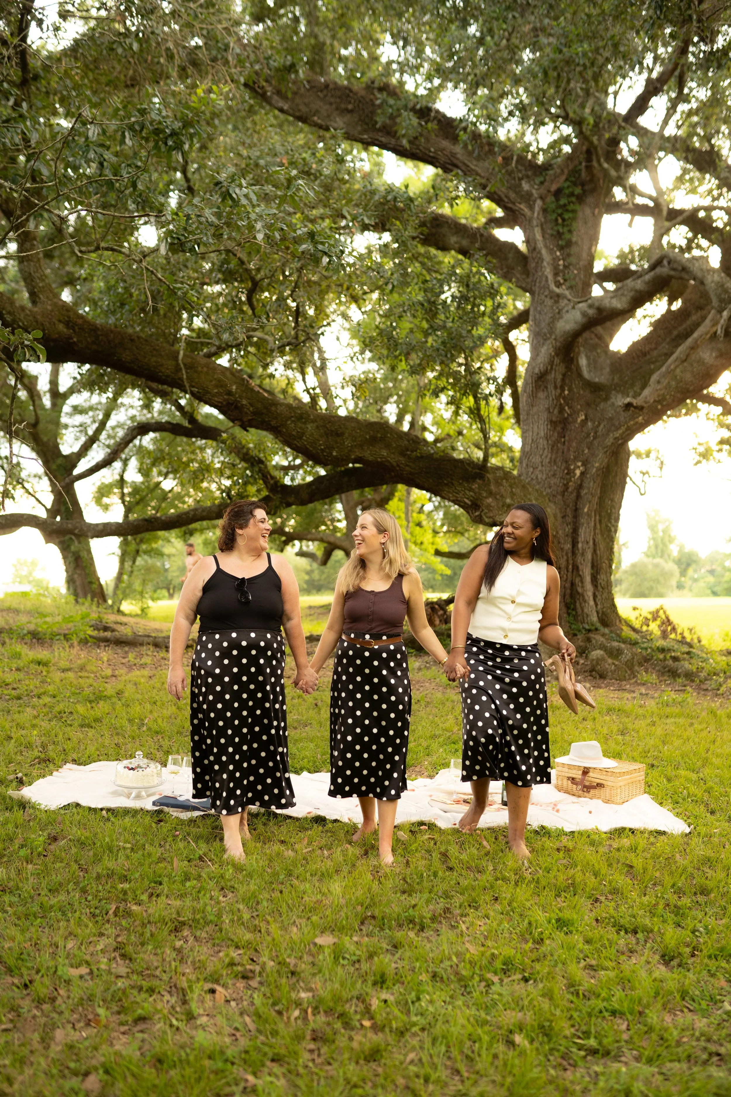 Black skirt with white polka dot pattern.