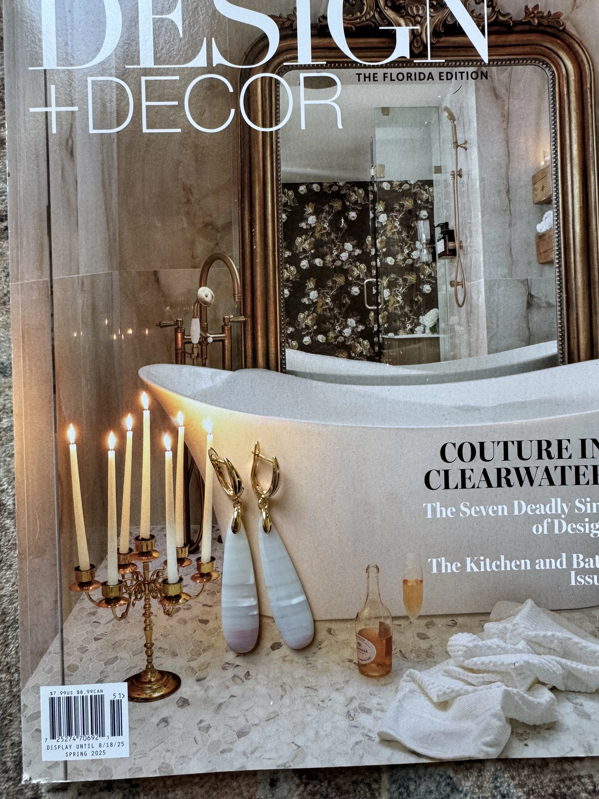 Gold statement earrings with a bold, polished design.