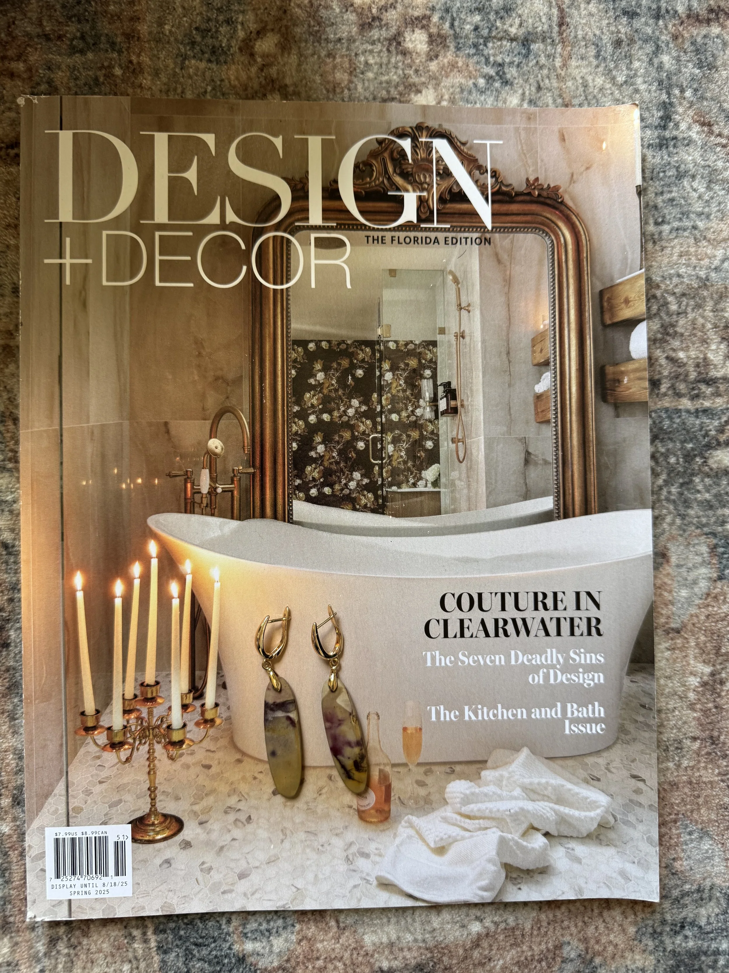 Gold statement earrings with a bold, polished design.