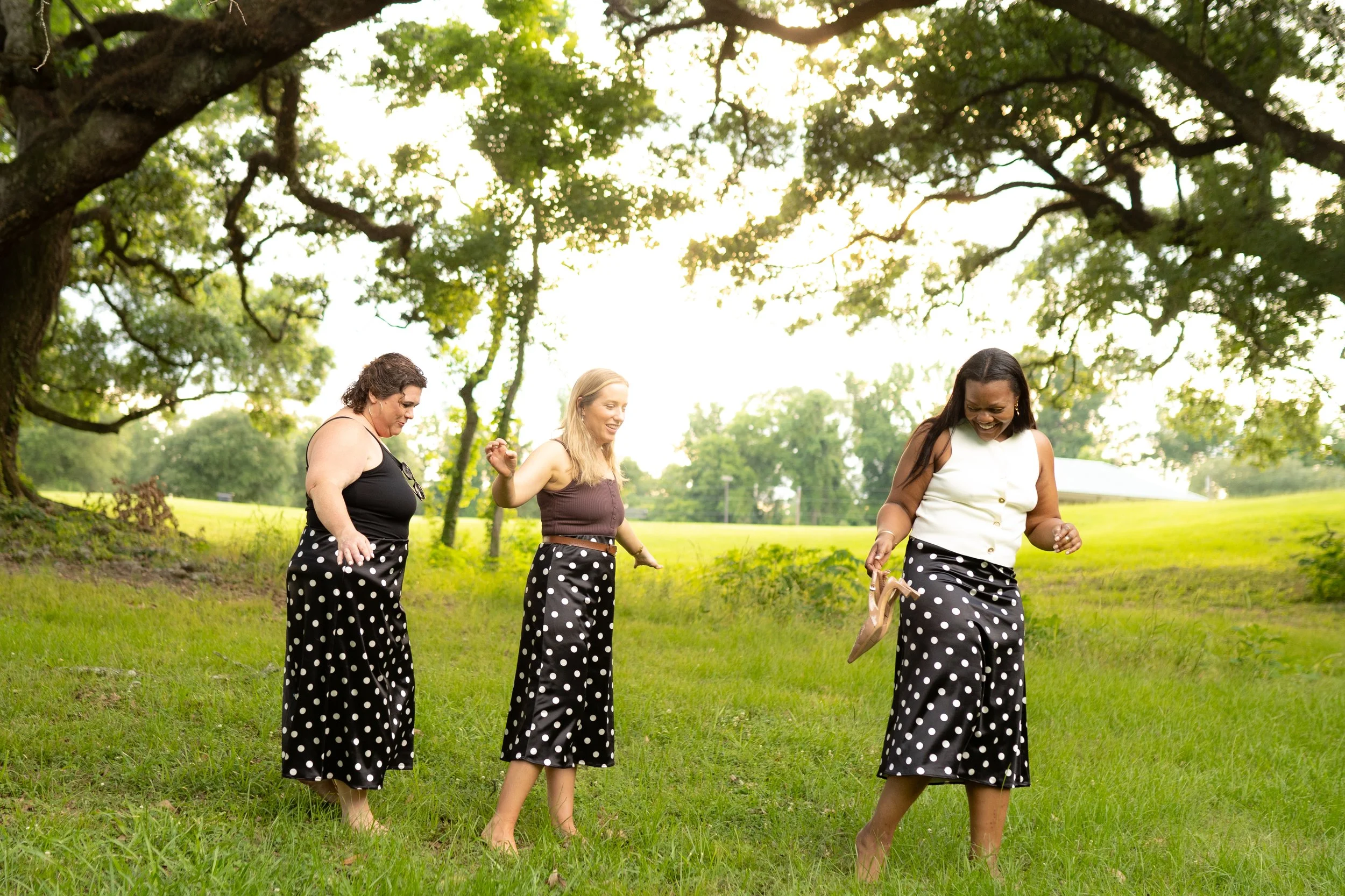Black skirt with white polka dot pattern.
