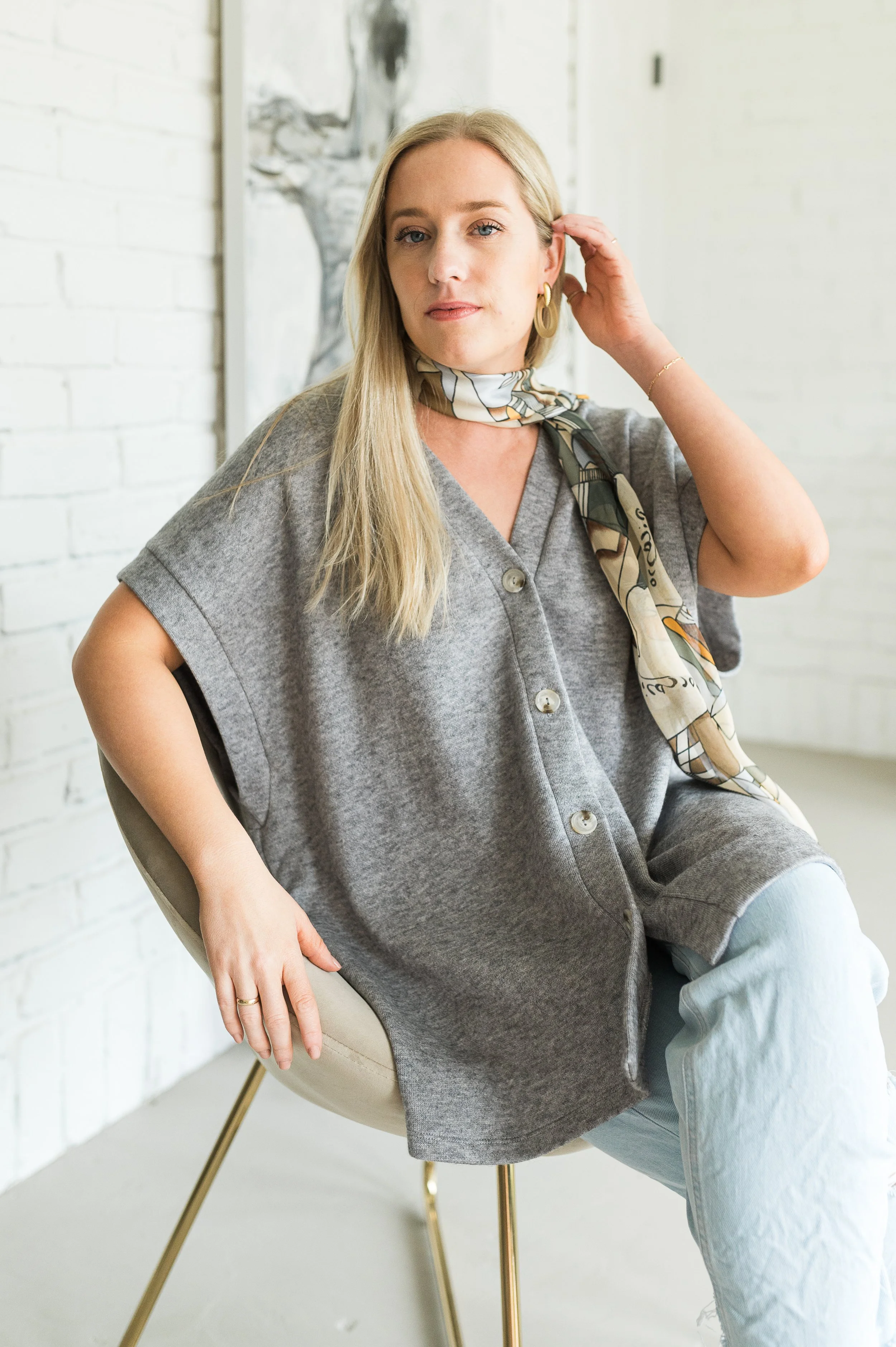 Gray sleeveless vest with a relaxed silhouette.