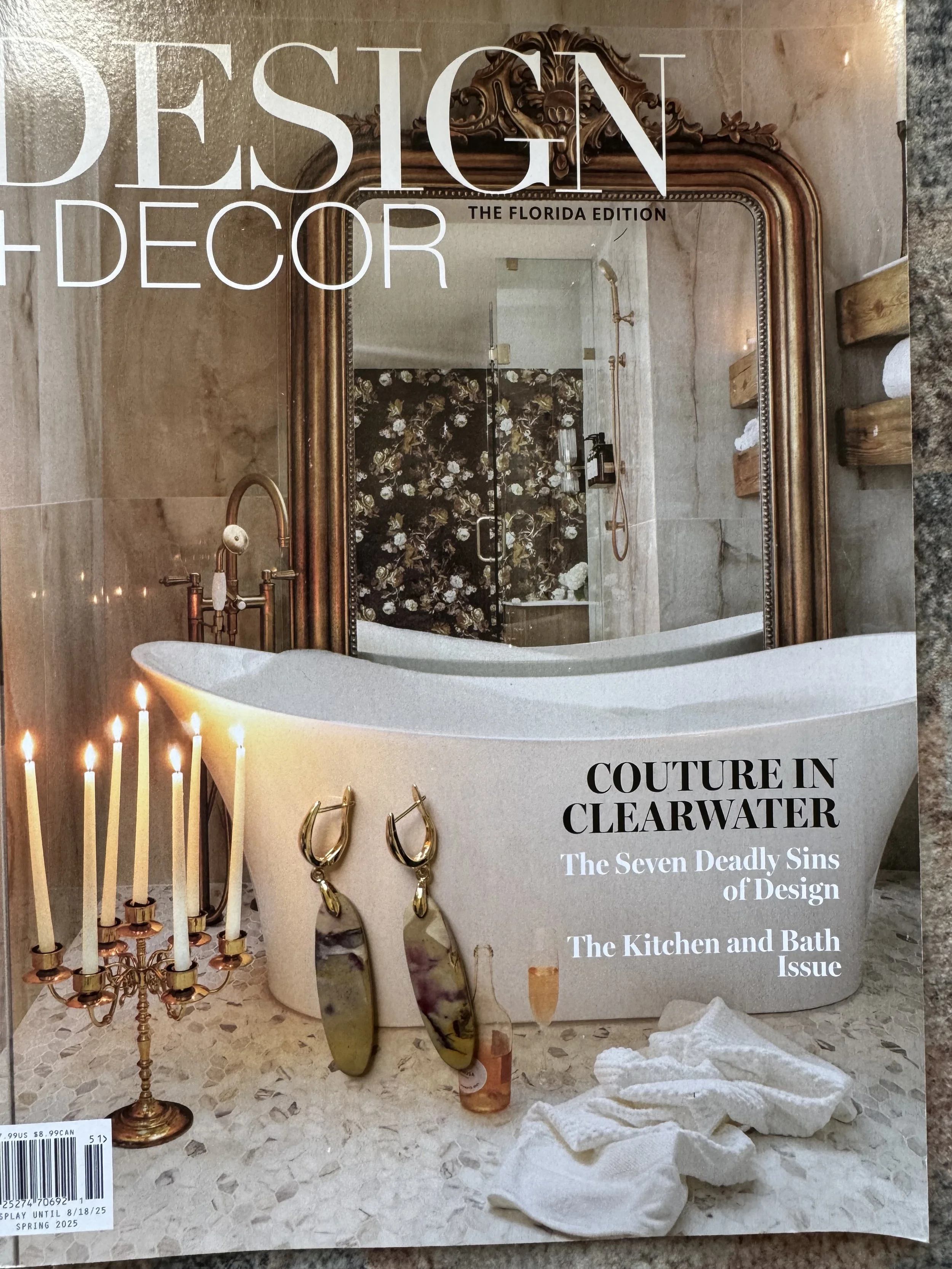 Gold statement earrings with a bold, polished design.