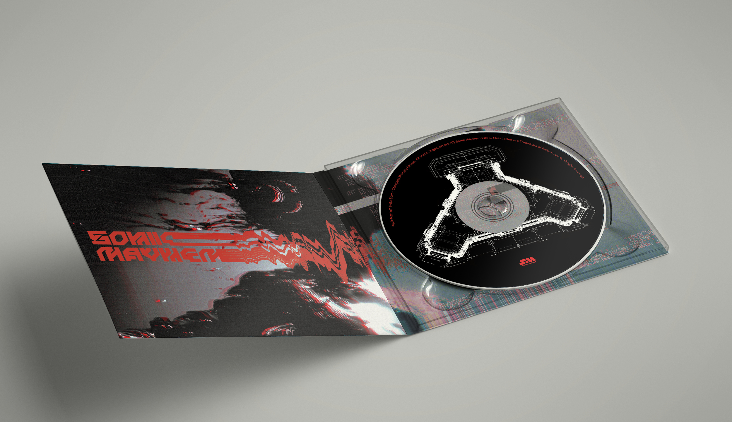 Open CD case with a black disc featuring a white schematic of a steering wheel, resting on a white surface.