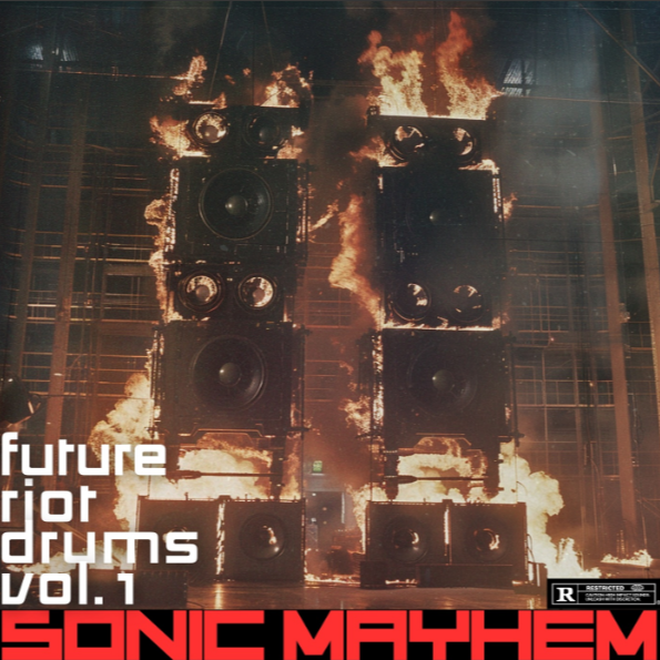 A concert or installation with large speakers on fire, flames surrounding and engulfing them, with a dark background and wooden scaffolding or framing structure.