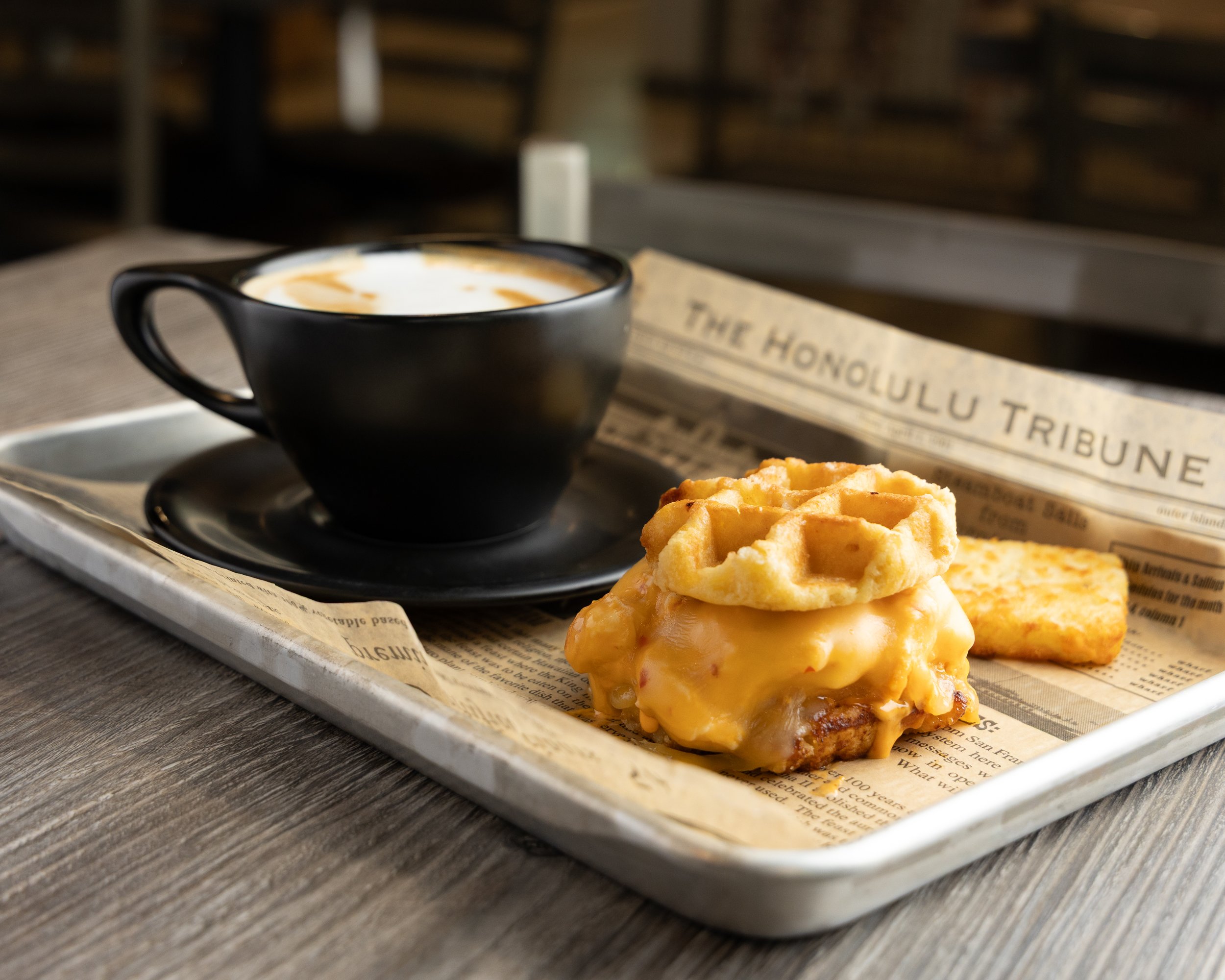 Waffle breakfast sandwich and a latte