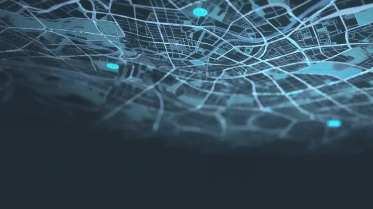 Digital map of a city with illuminated streets and highlighted locations.