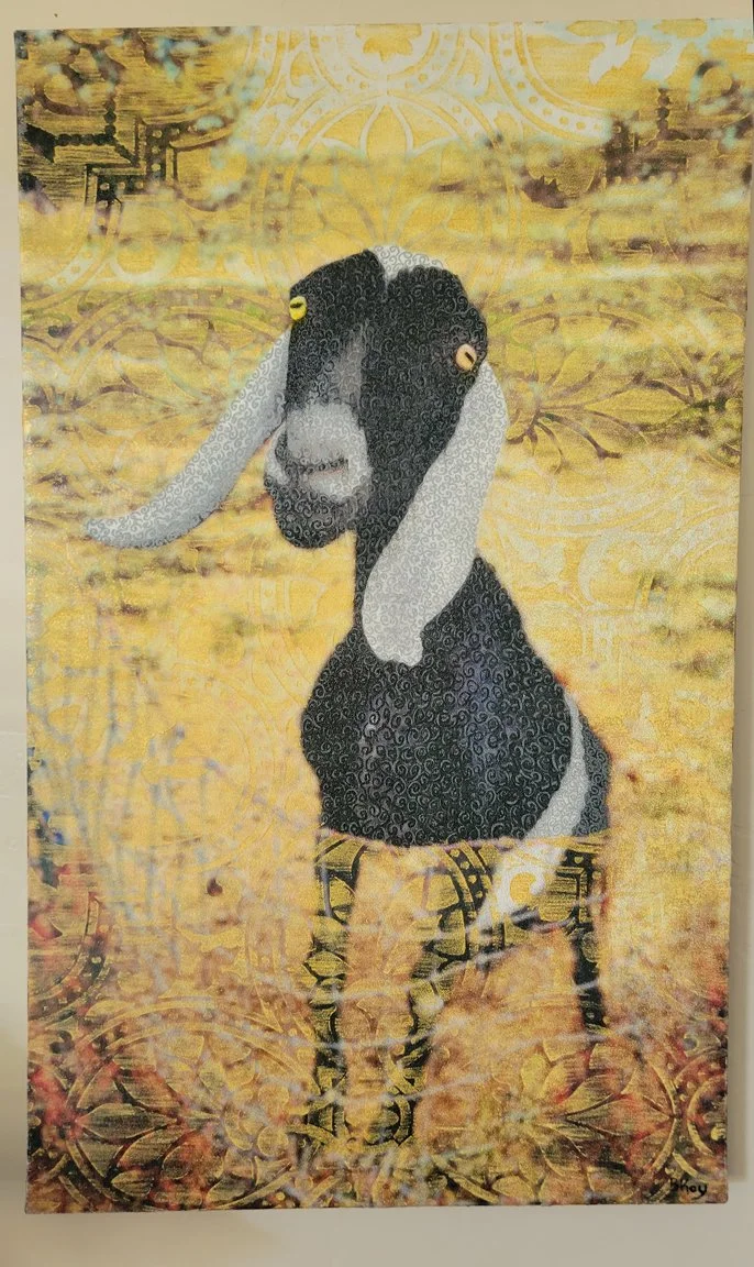 Mixed media artwork depicting a goat with a black and white face, yellow eyes, and patterned horns, set against a vibrant yellow background with intricate designs.
