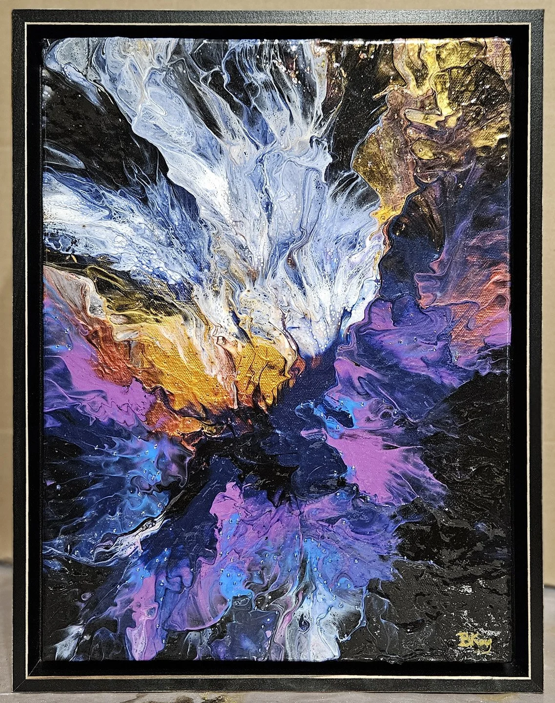 Abstract painting with vibrant colors including black, white, blue, yellow, purple, and pink, featuring swirling and flowing patterns.