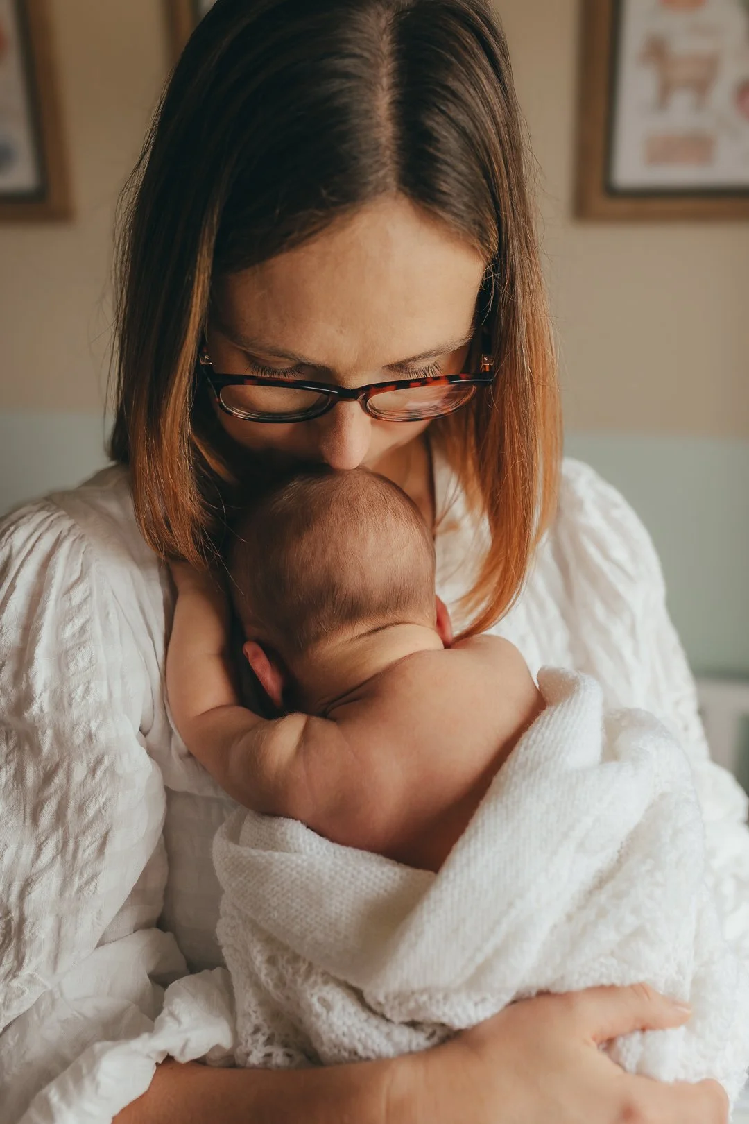 Mother cuddling her baby during a relaxed family photoshoot in Colchester, Essex.