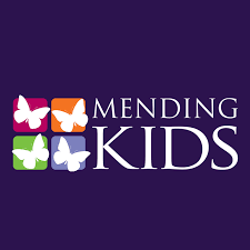 Mending Kids logo with four colorful butterfly icons in pink, orange, green, and white, and the text 'Mending Kids' on a purple background.