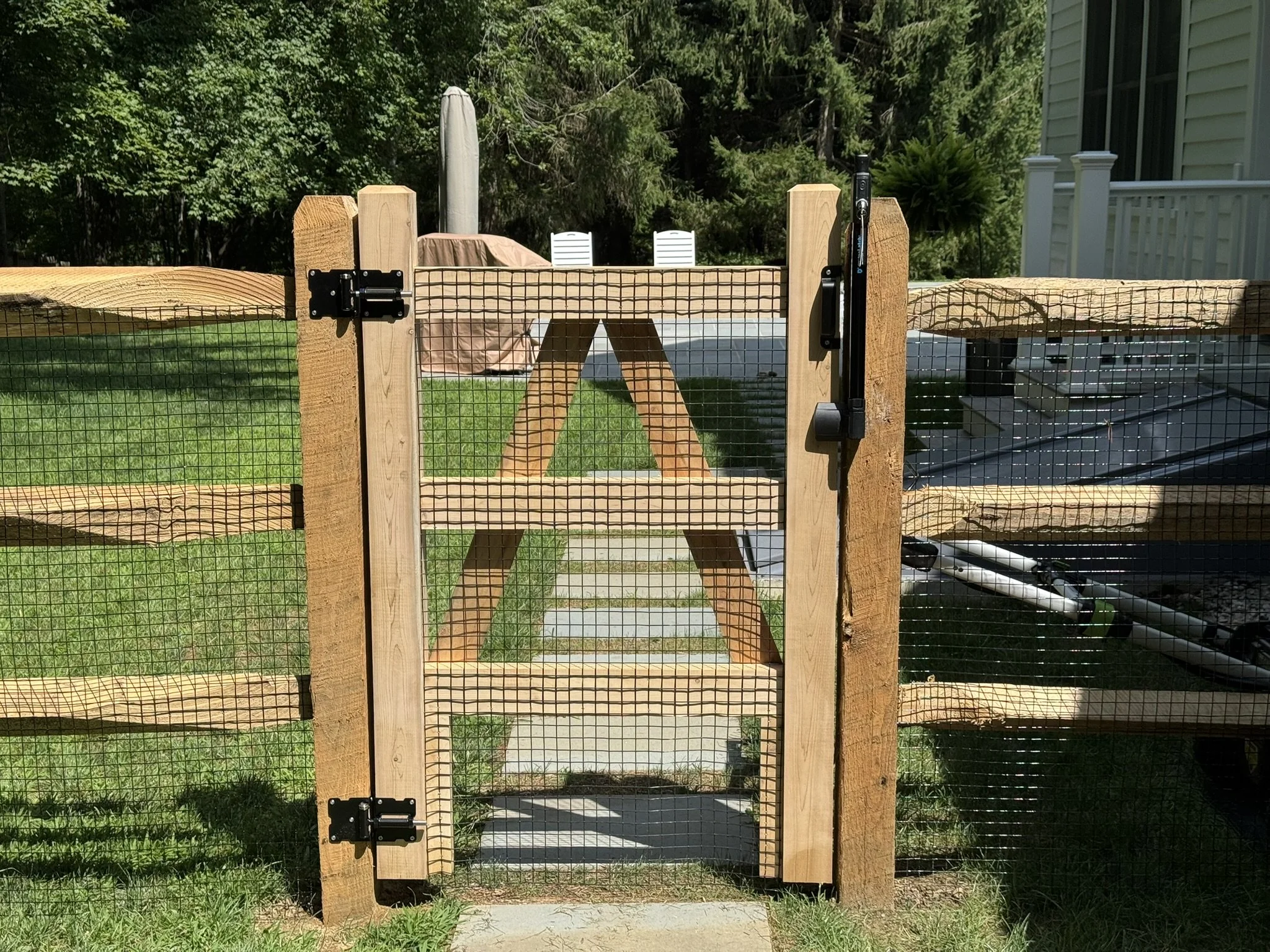 Cedar post and rail pool code gate in Ridgefield CT