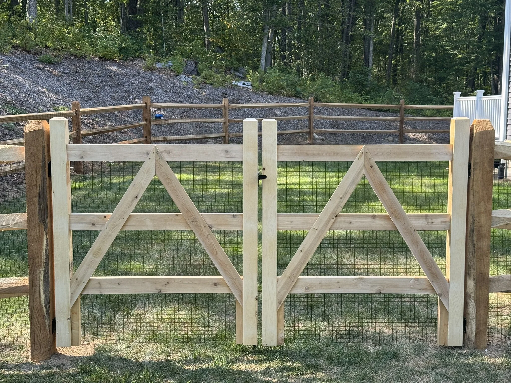 Cedar post and rail double drive gates in Newtown CT