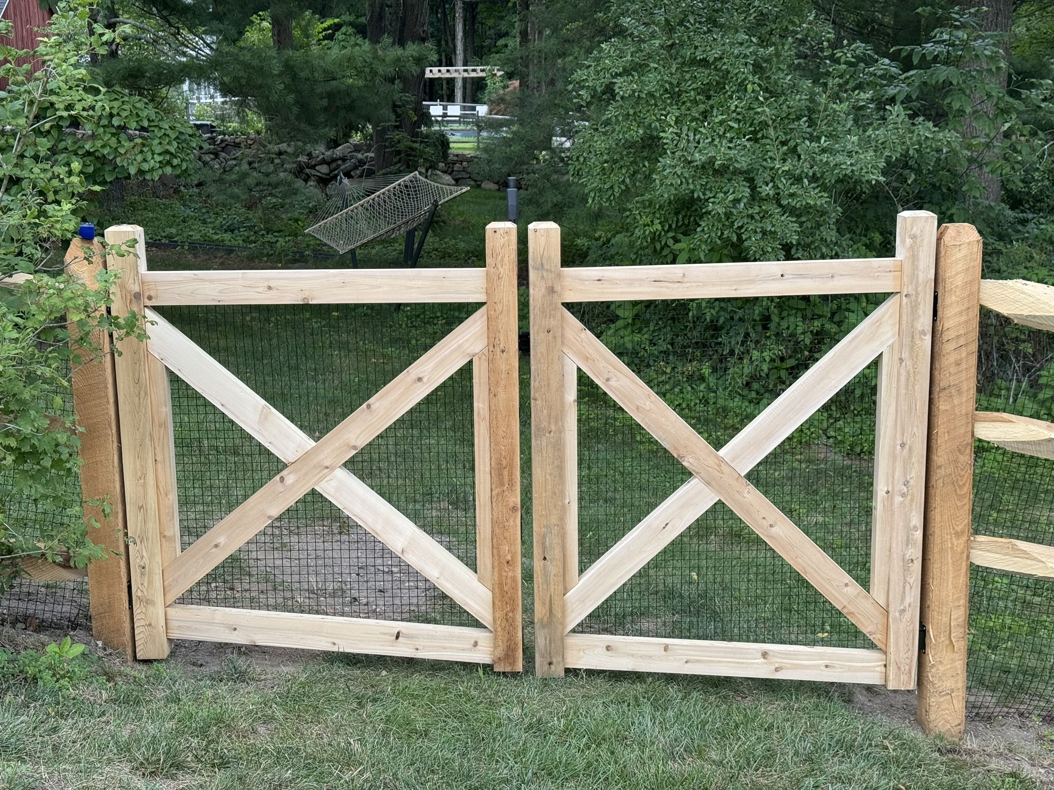 Racked Cedar post and rail gates built to grade inside shot in Morris CT