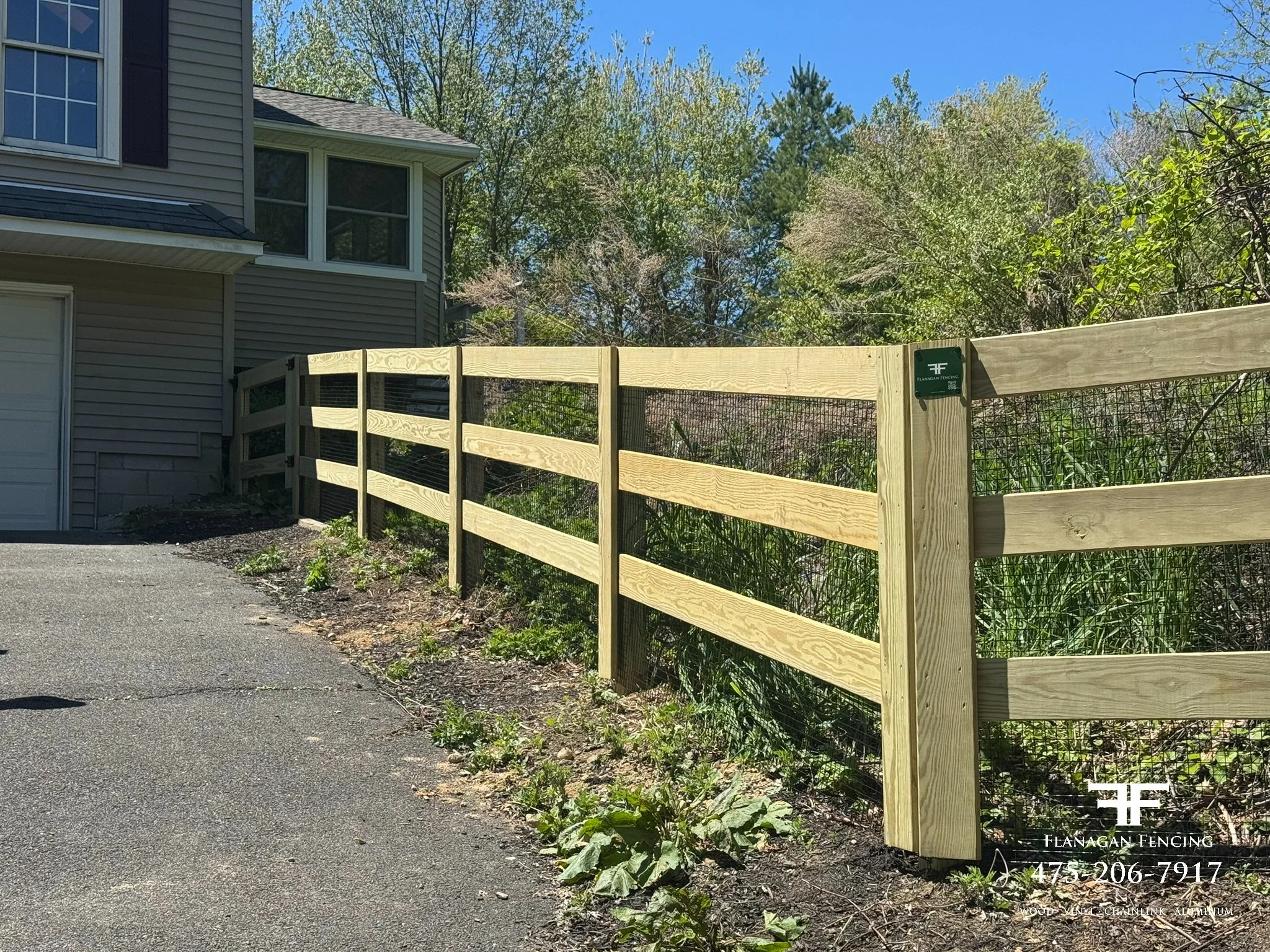 3-Rail pressure treated paddock fence with welded wire in Brookfield, CT.