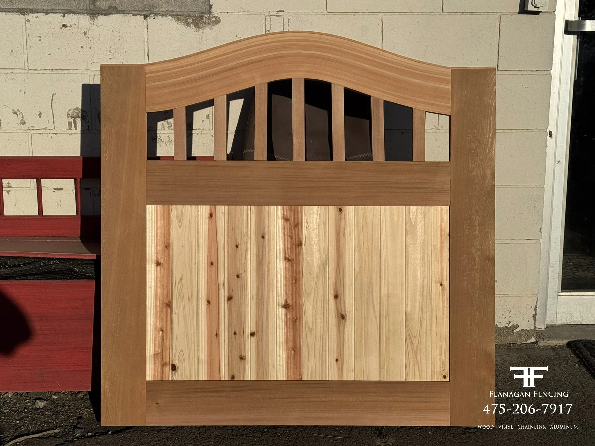 Custom red clear cedar arch top gate fabricated in our shop, Brookfield, CT.