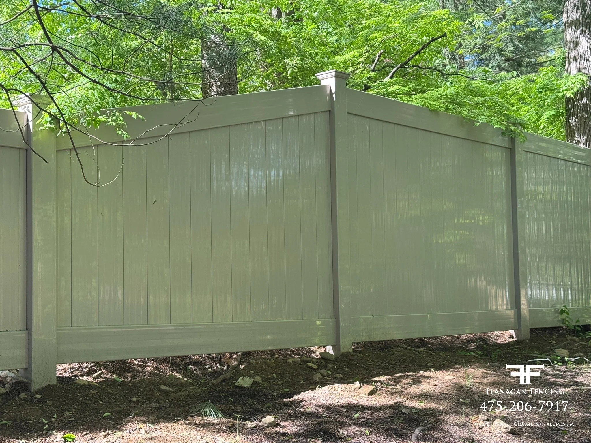 Tan vinyl tongue & groove privacy fence 6' to 4' transition in Redding, CT.