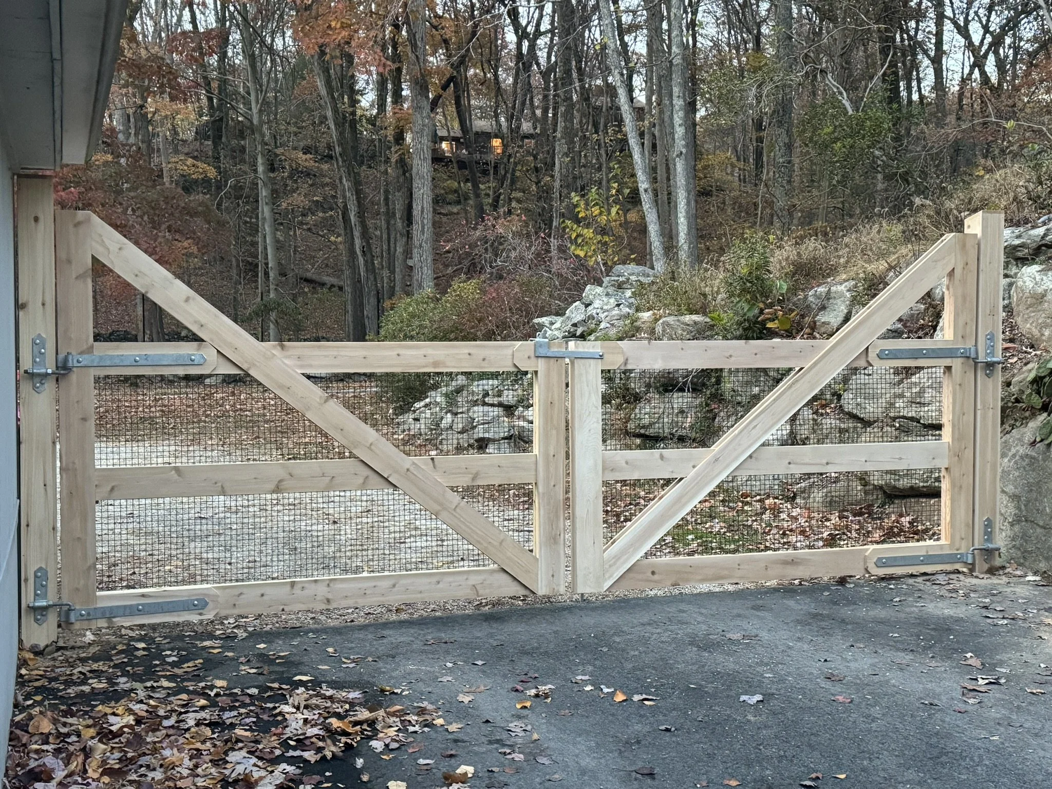Custom white cedar driveway gates in Weston, CT.