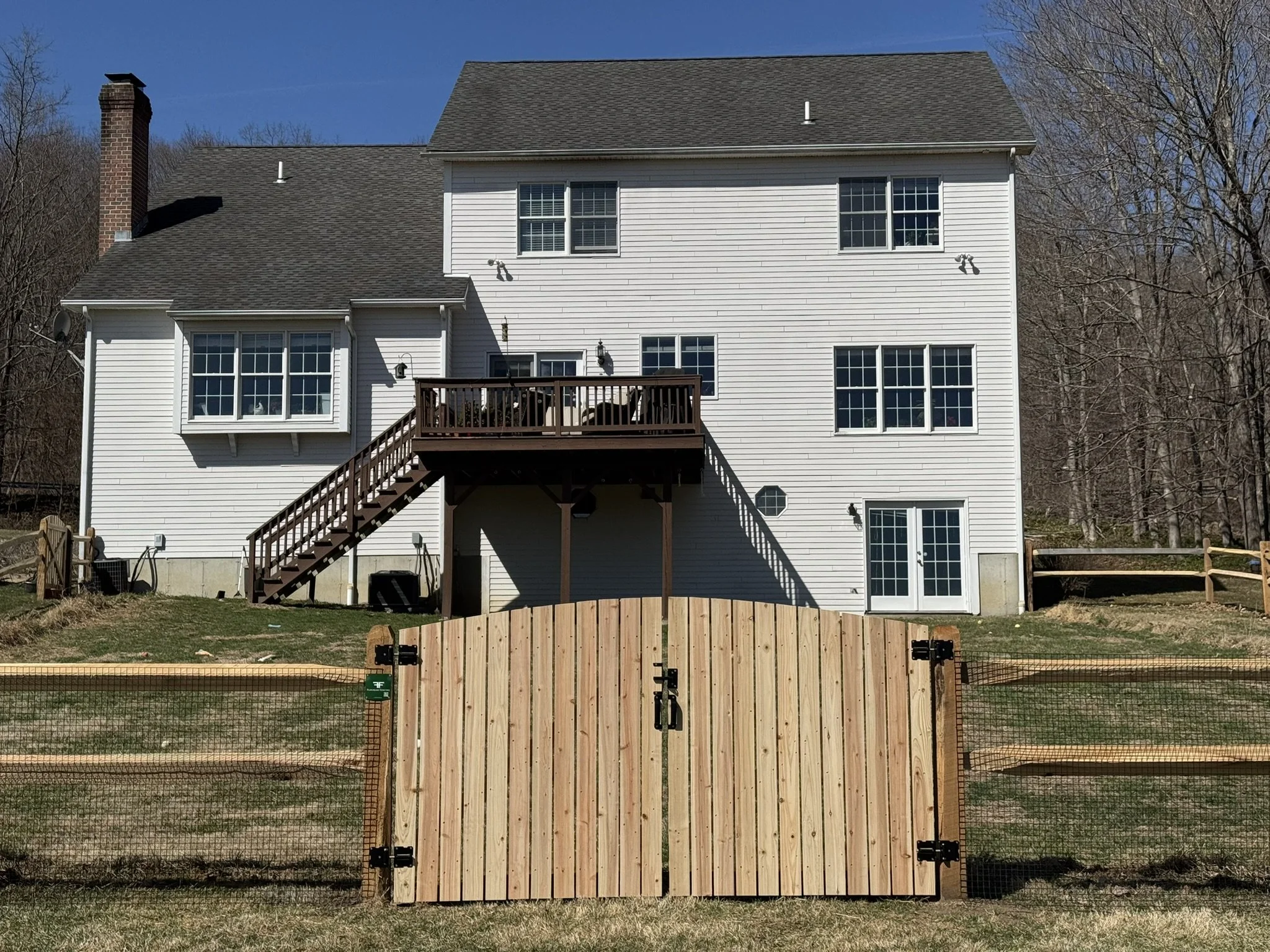 Custom cedar split rail gates in Newtown, CT.