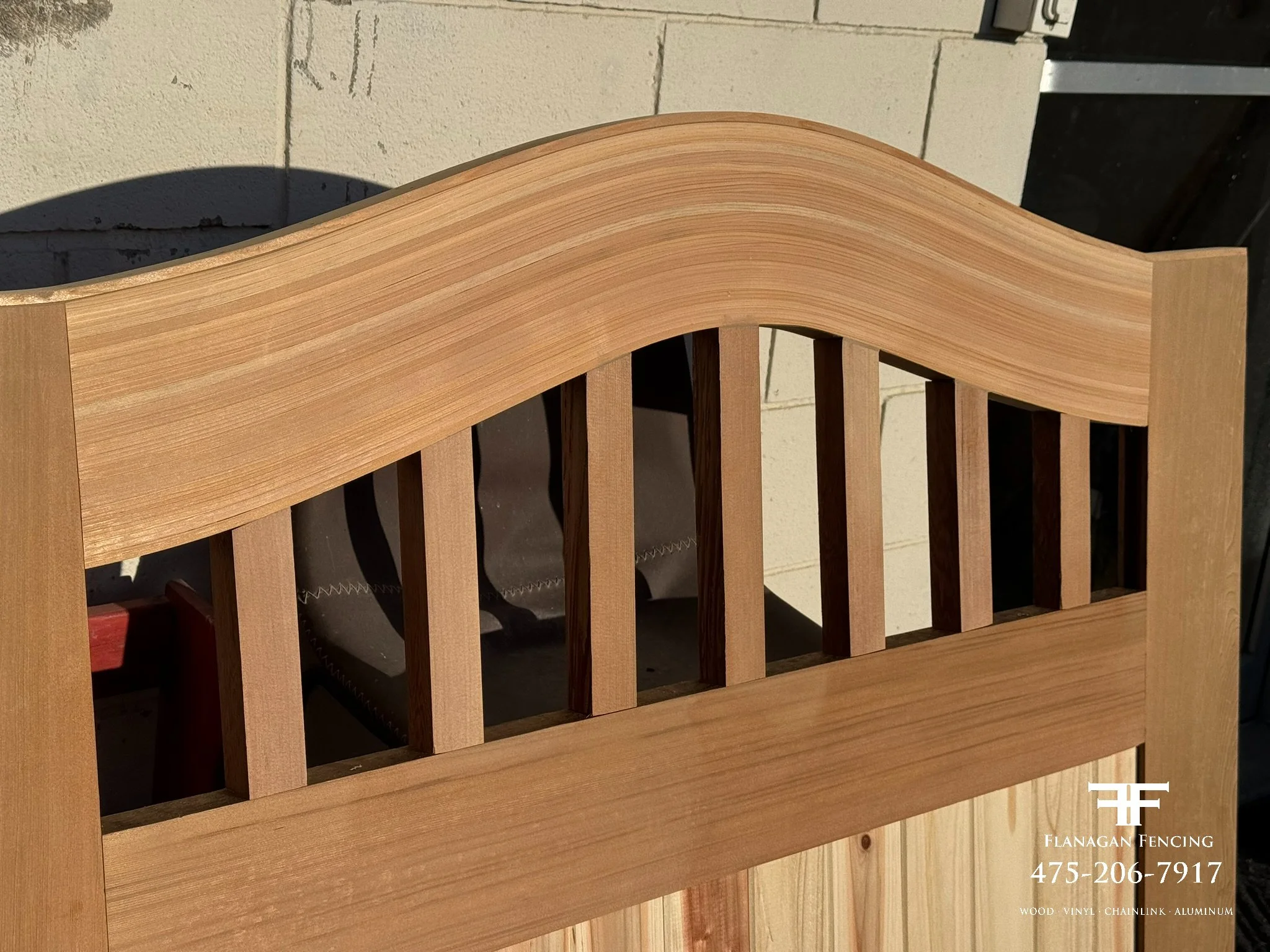 Custom red clear cedar arch top gate fabricated in our shop, Brookfield, CT.