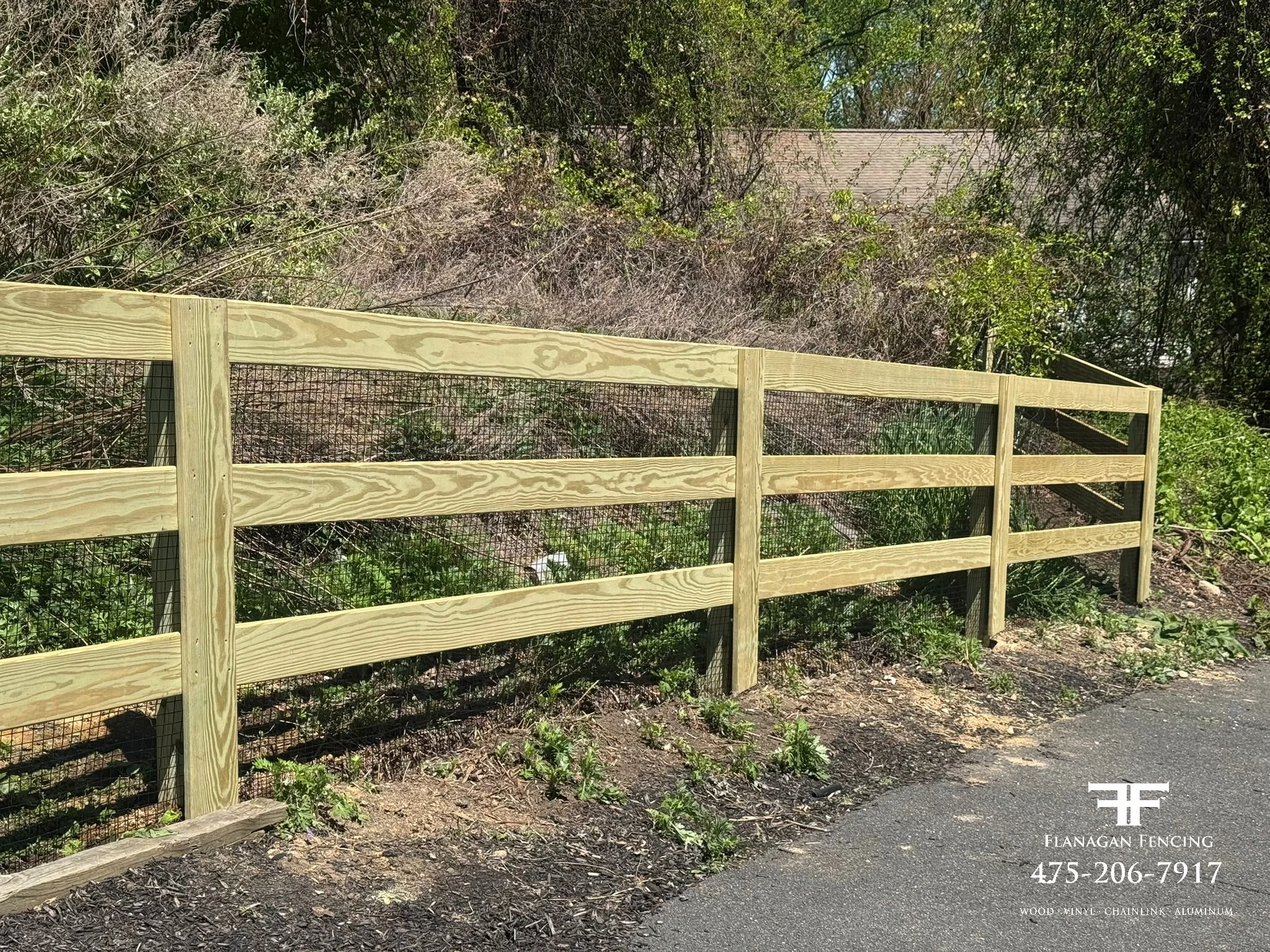 3-Rail pressure treated paddock fence with welded wire in Brookfield, CT.