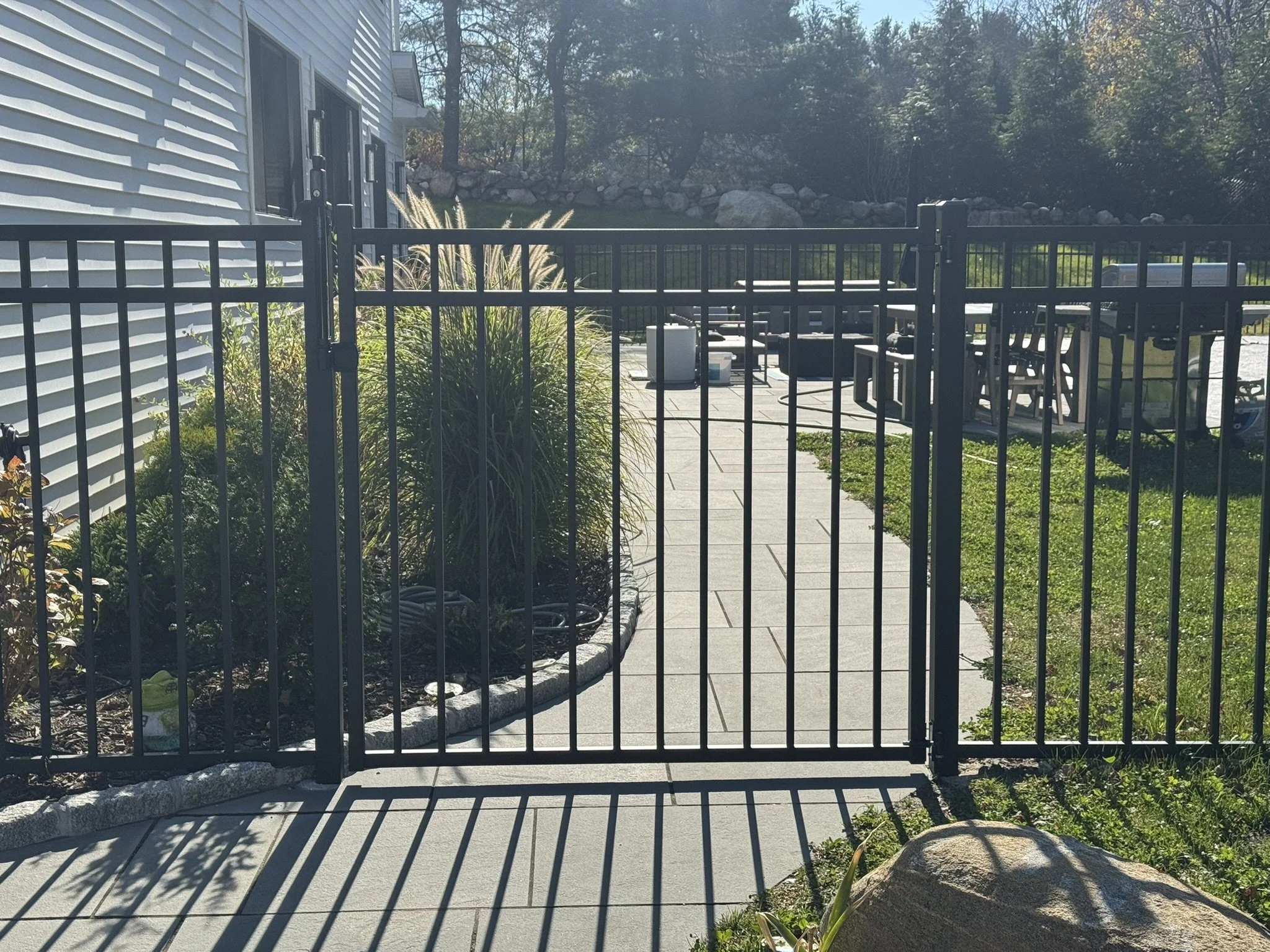 Matte black aluminum pool code fencing installed in New Canaan CT