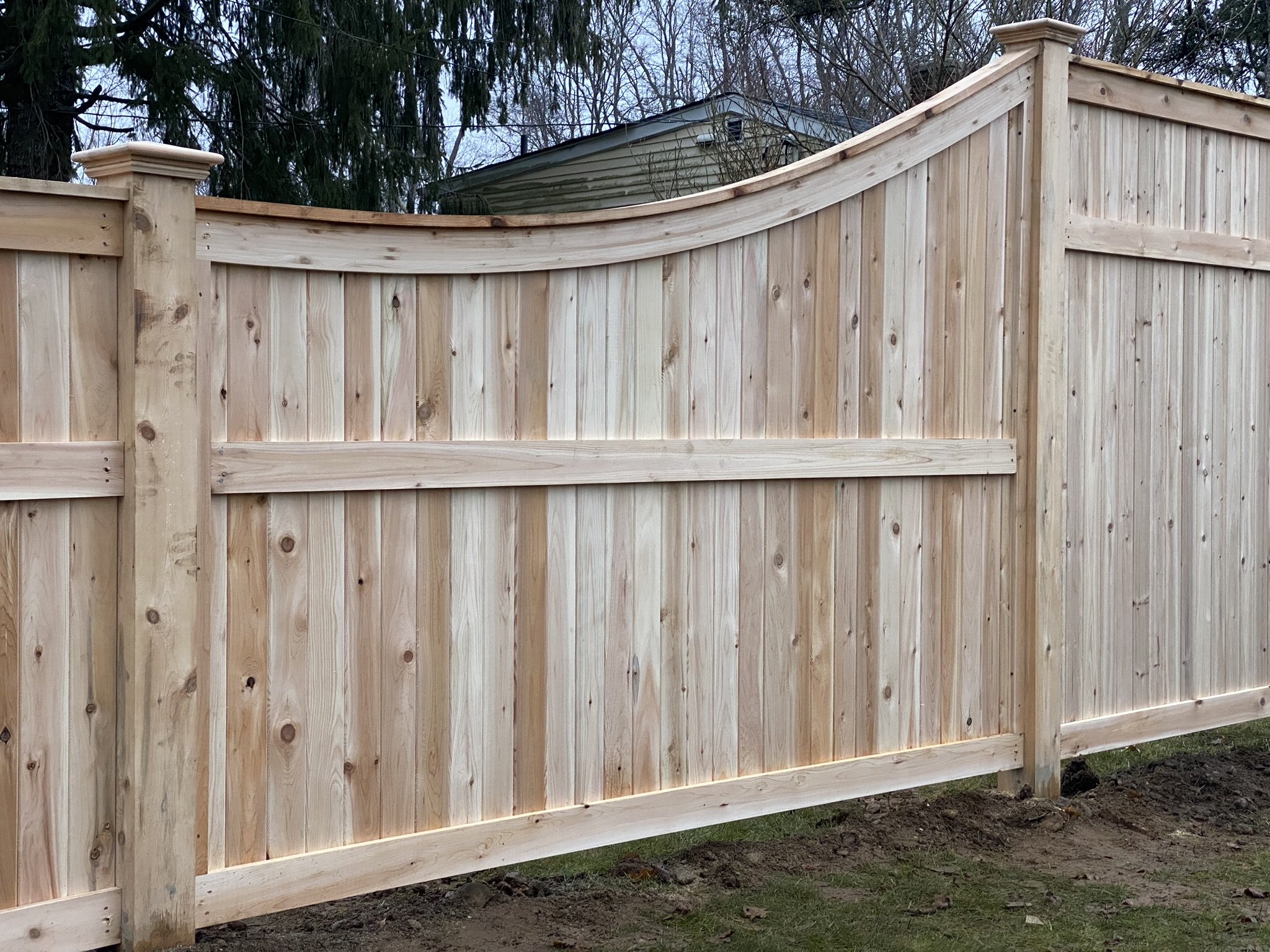 Custom cedar privacy fence transition in Trumbull, CT.