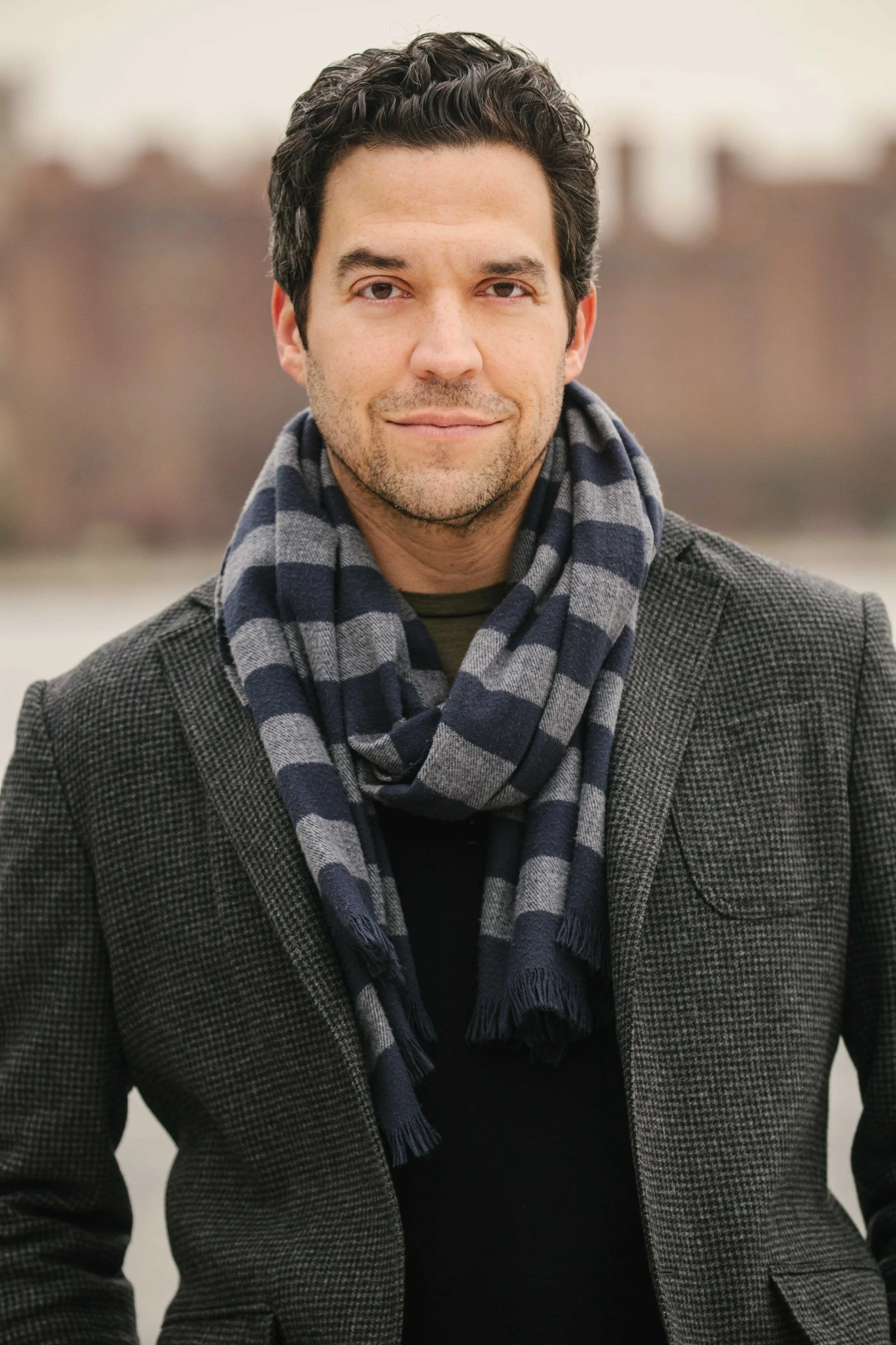 Headshot of NYC-based actor Aaron Serotsky of Marvelous Mrs. Maisel, Ray Donovan, House of Cards, Dopesick, The Good Doctor, Julia. Image taken in Williamsburg on the East River promenade.