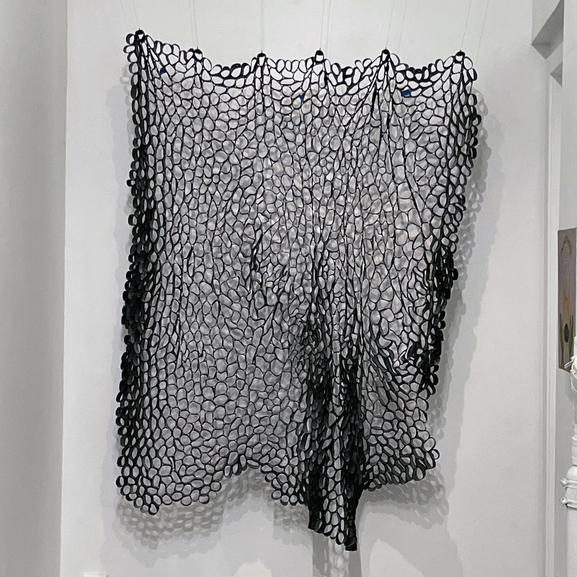Monika Mayer, Soft Sculpture #7 – Fluidity, 2023, inner tubes, staples, obsidian crystal donut beads, wire, 66 x 50

