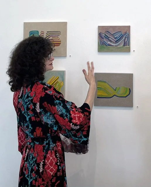 Laura Rose Komada with her work