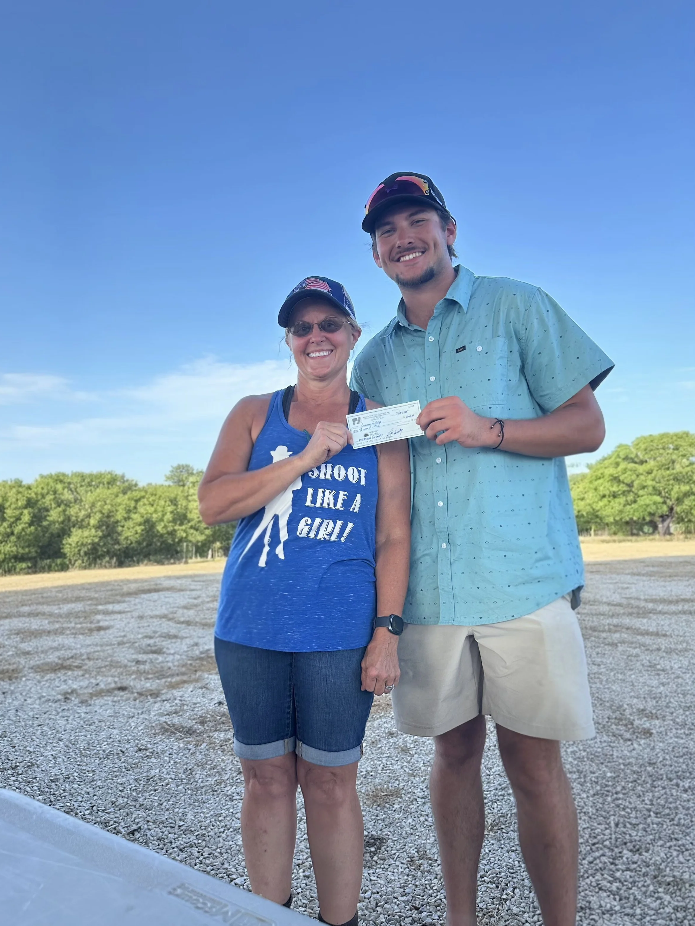 2025 Scholarship Winner holding check