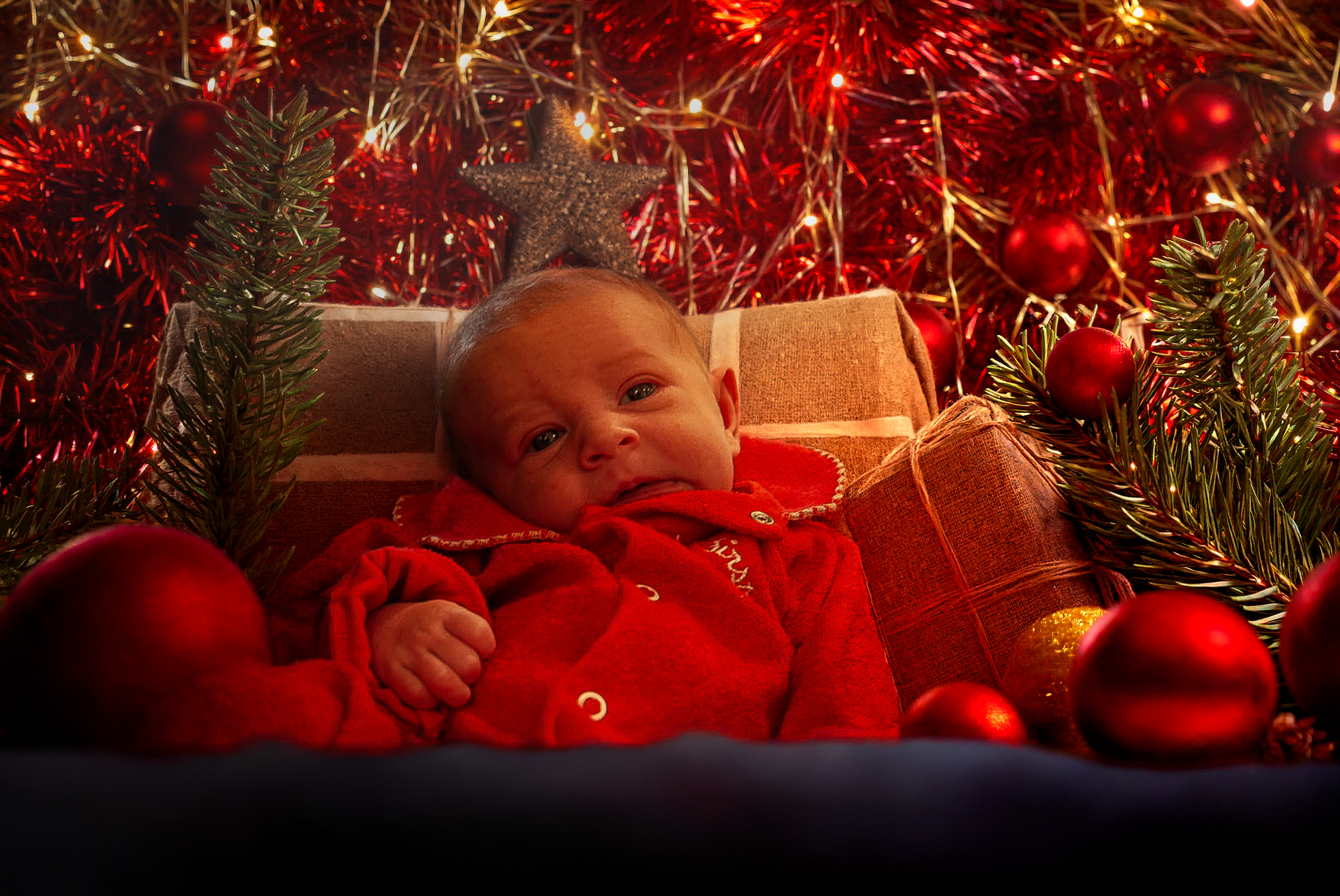Warm, cozy Christmas family portrait featuring a smiling family in matching pajamas gathered around a decorated tree and fireplace. This holiday photo captures authentic joy, connection, and festive traditions perfect for seasonal cards and keepsakes