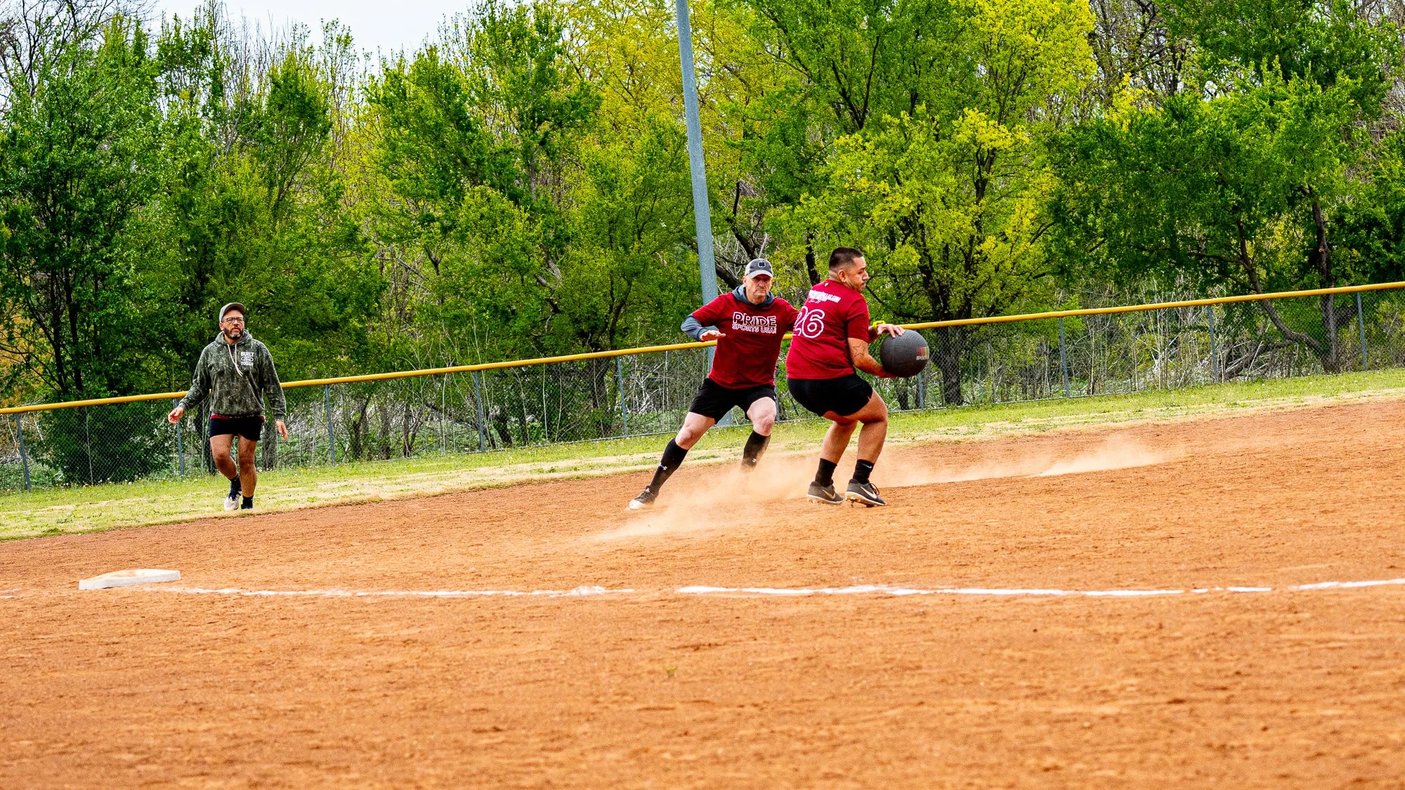 Man catching the ball with team coverage. Sports Photography DFW.jpg